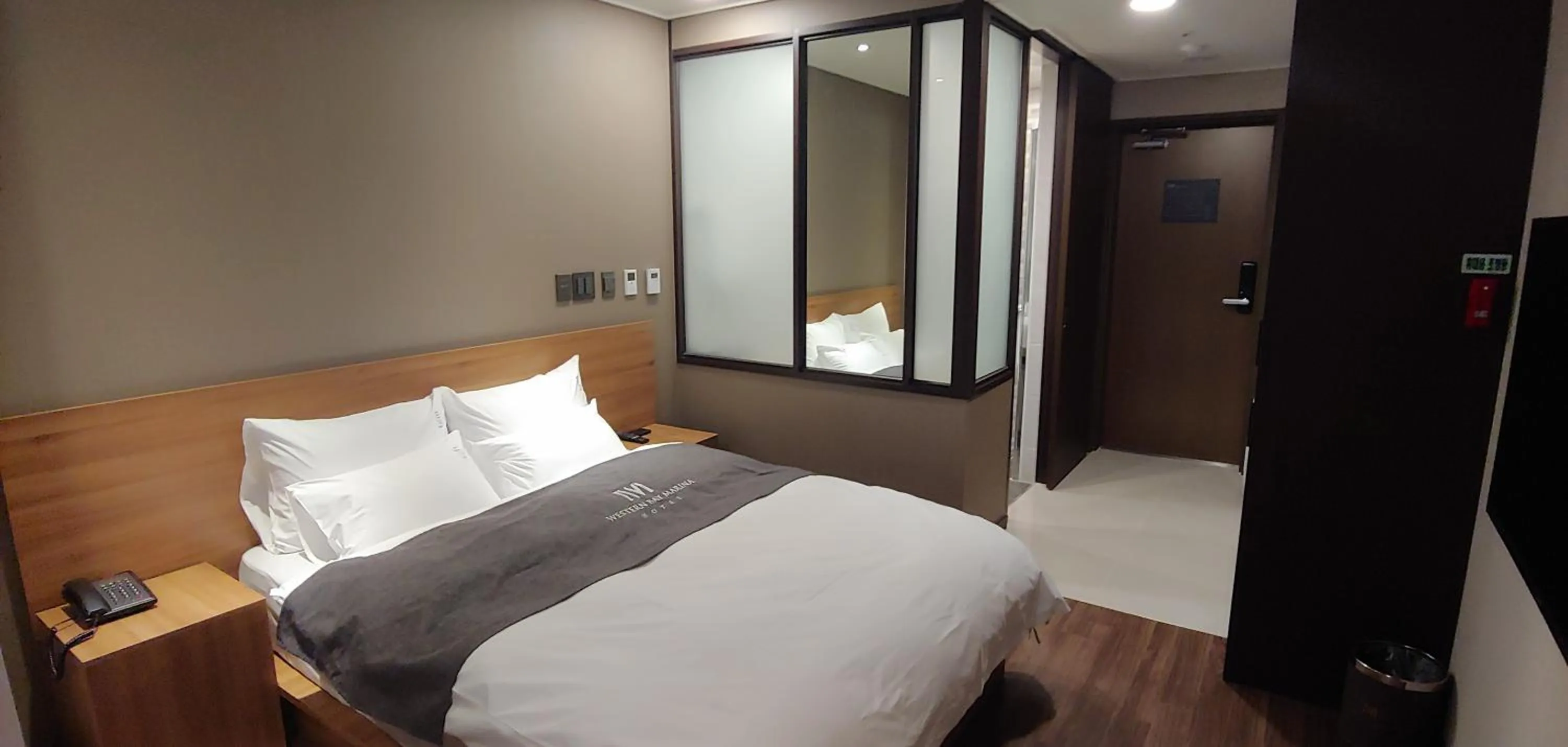 Bed in Western Bay Marina Hotel