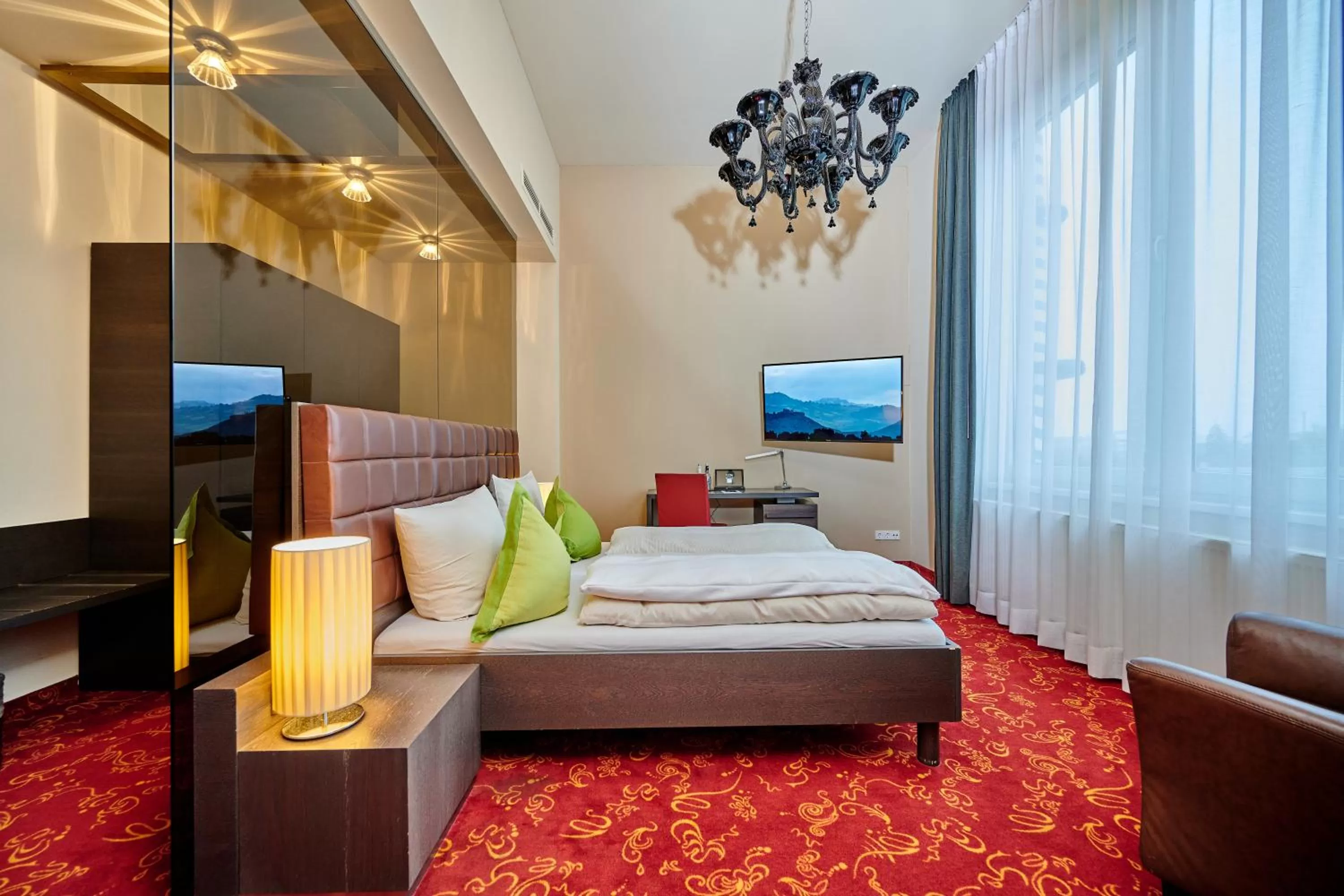 Photo of the whole room, Bed in Genusshotel Wenisch