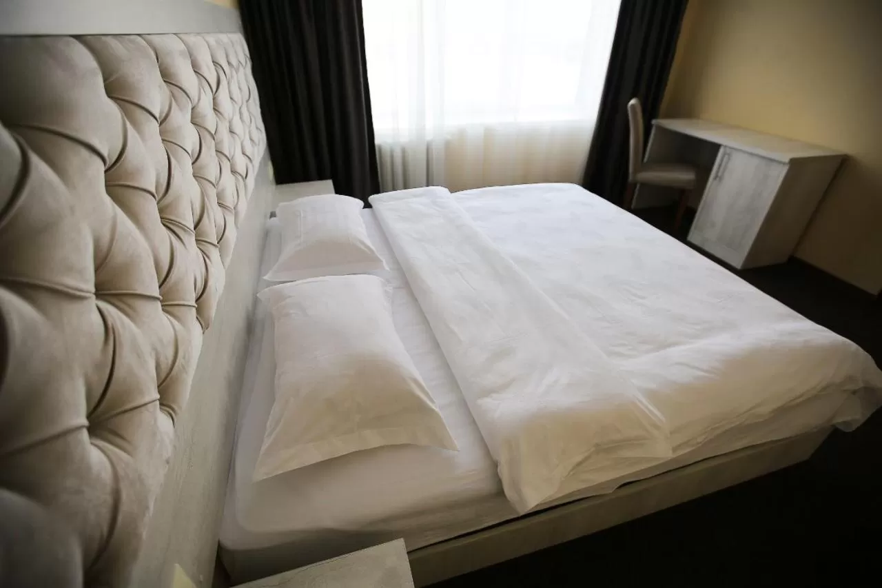 Bed in Altai Business Hotel
