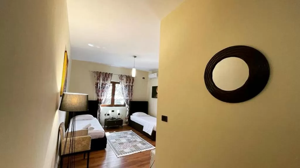 Bed in Hotel Ambasador Garden