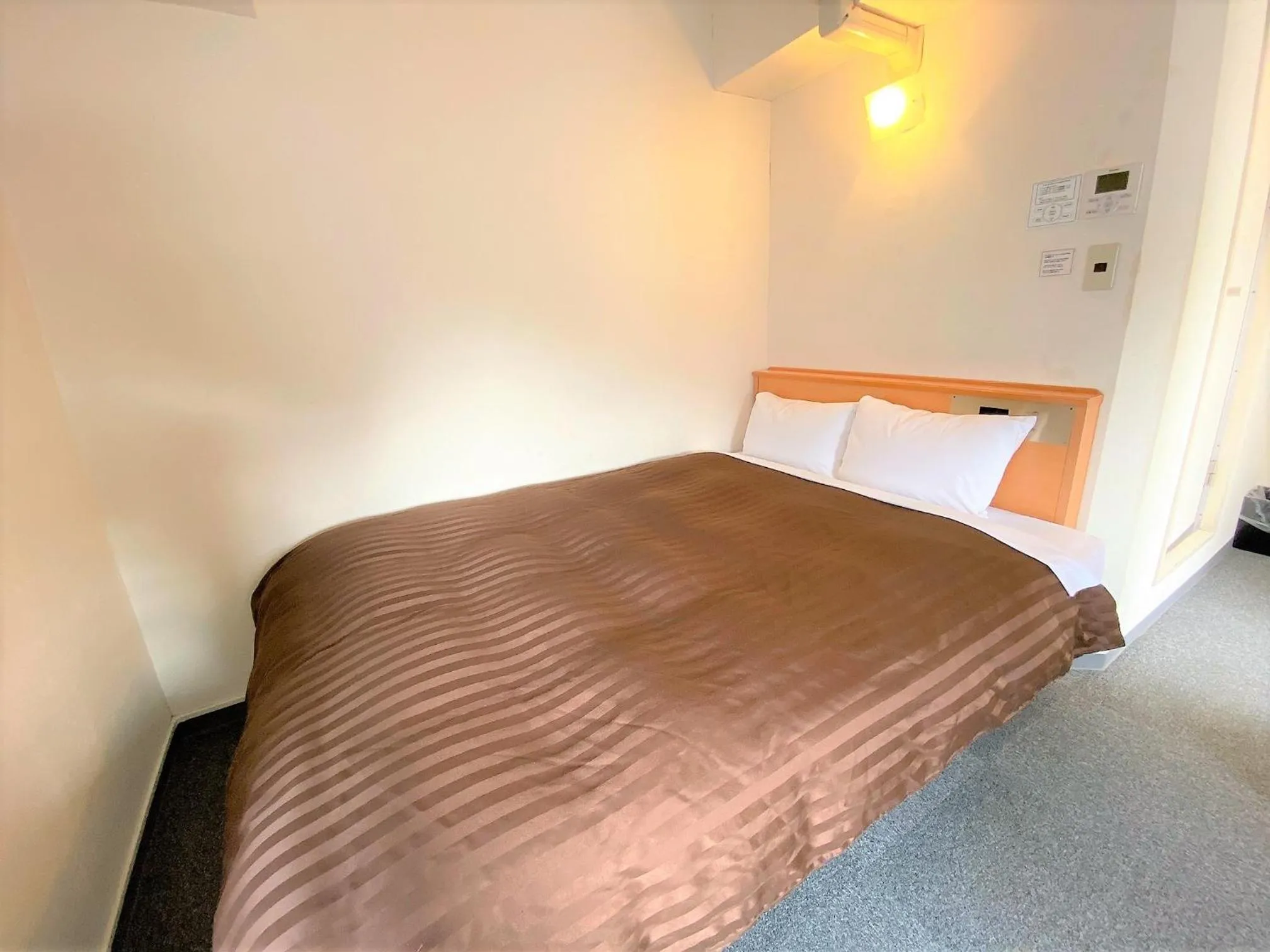 Bed in Sakura Hotel Hatagaya