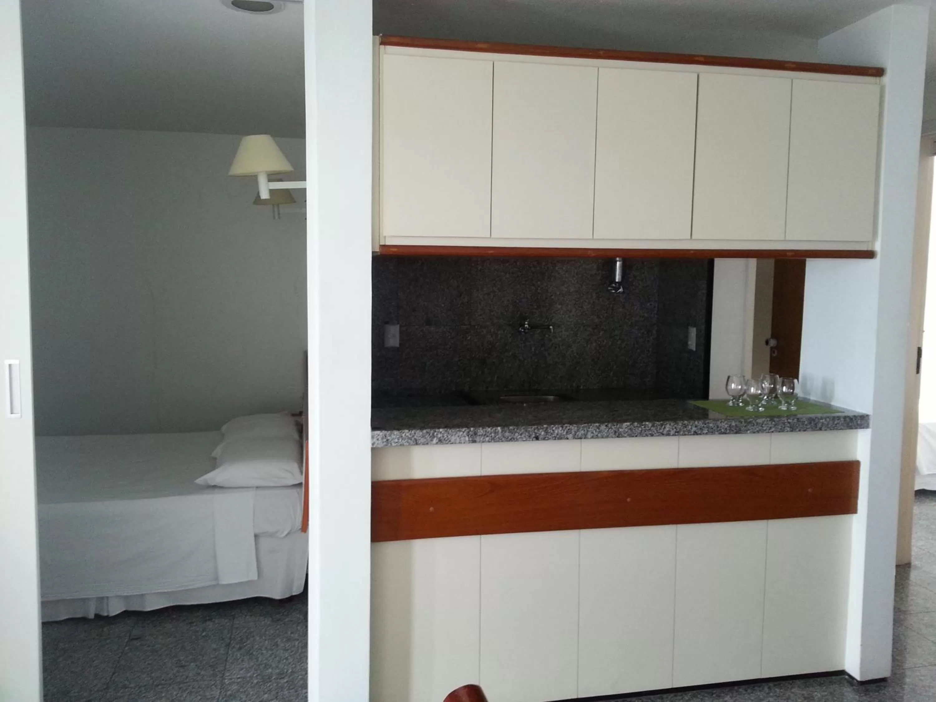 Photo of the whole room, Kitchen/Kitchenette in Iracema Residence Hotel Flat