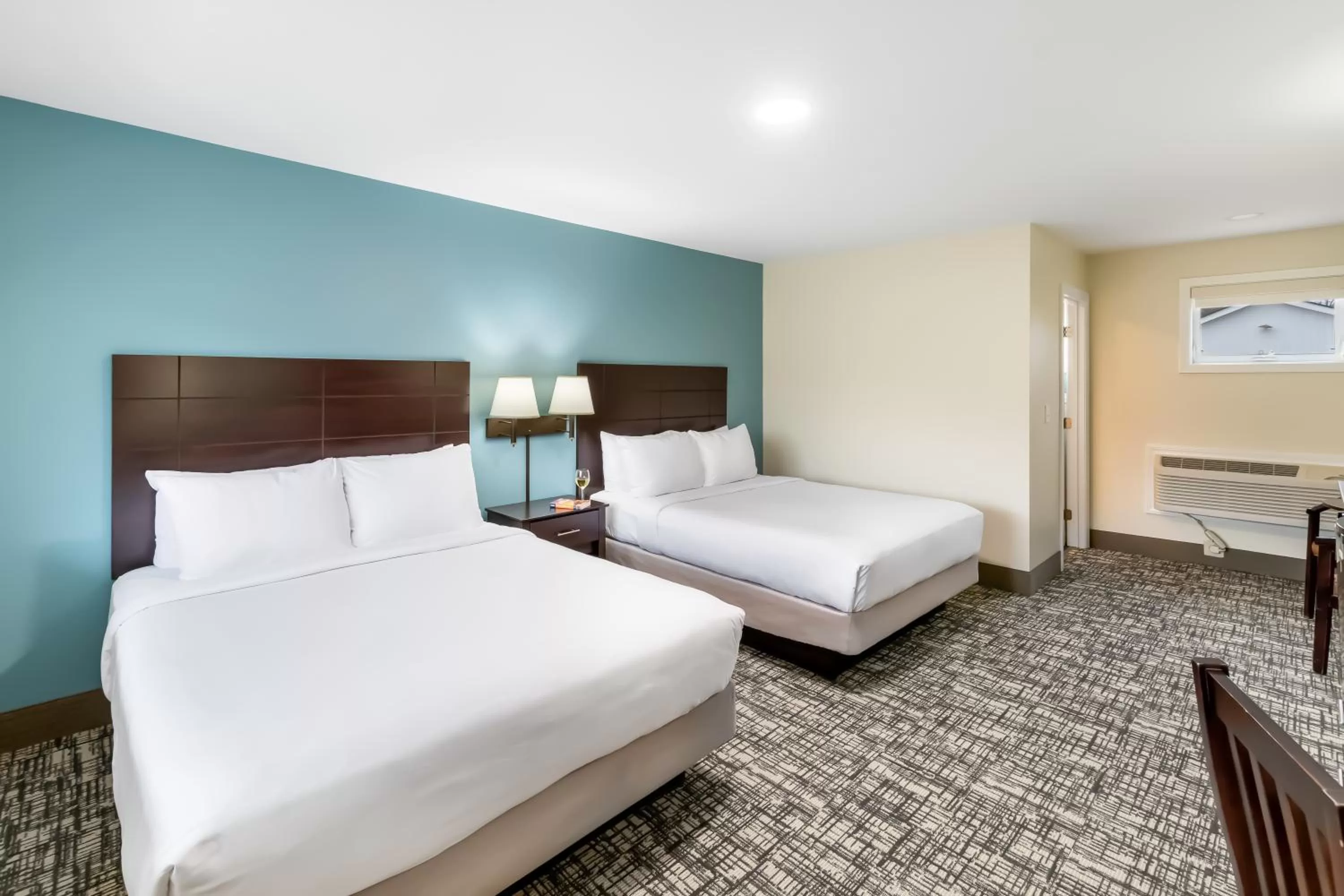 Bed in Top Notch Inn