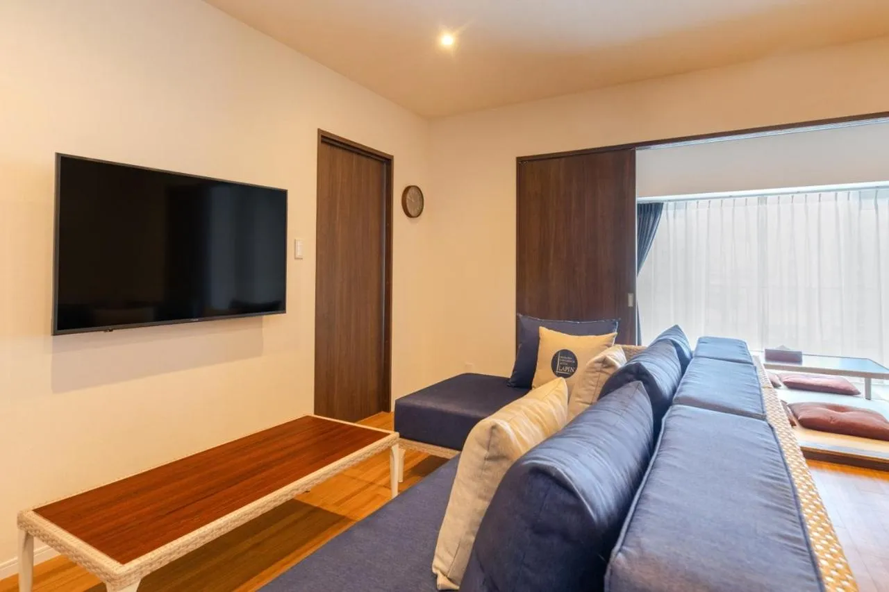 Living room, Bed in LAPIN MIHAMA Residence Hotel
