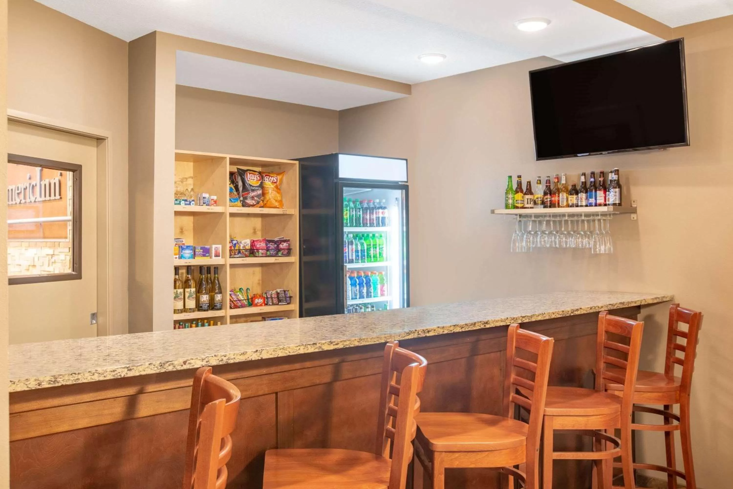 Lounge or bar in AmericInn by Wyndham Humboldt