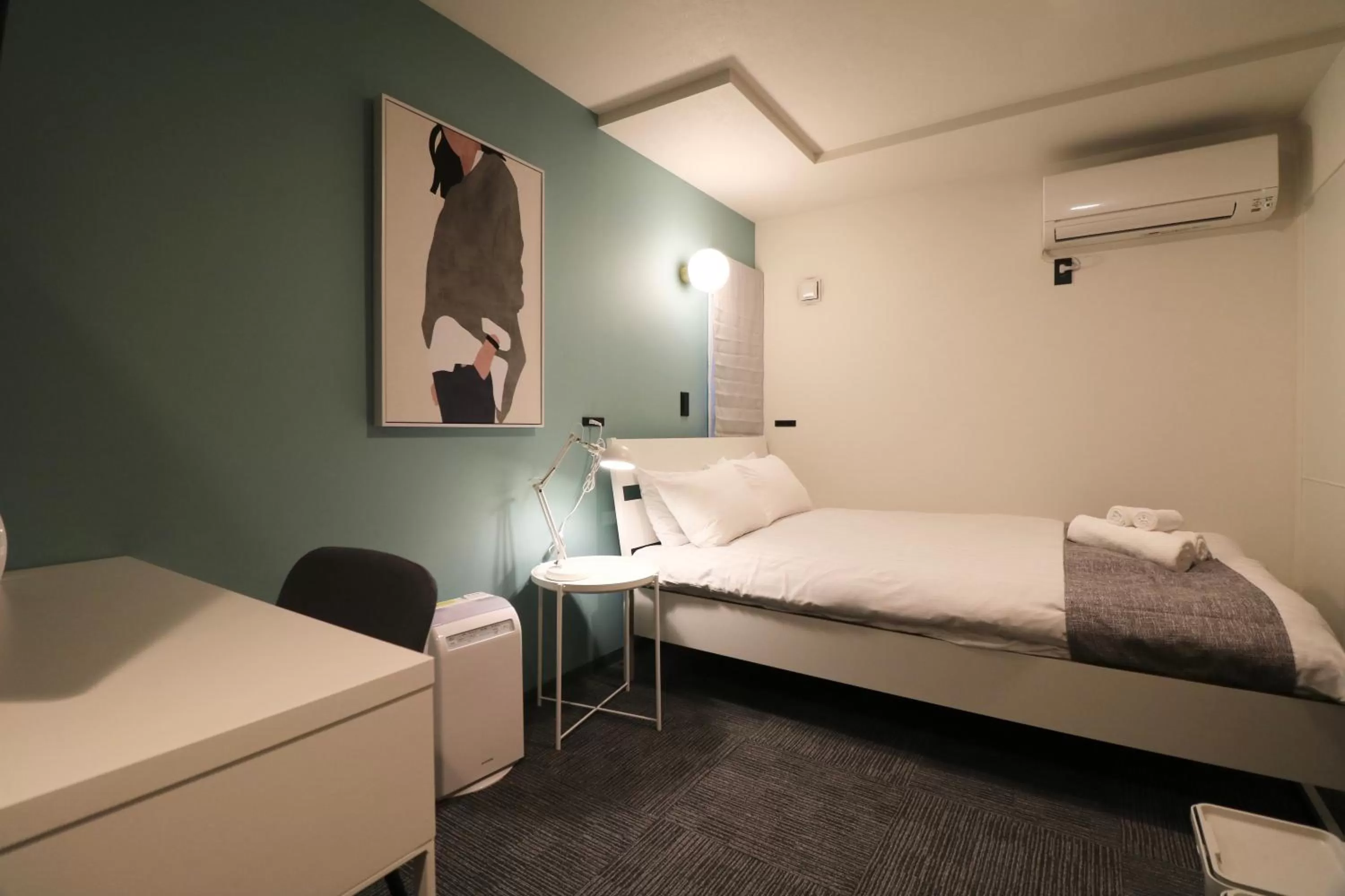 Bed in TAKETO STAY PREMIERE SAPPORO Eki