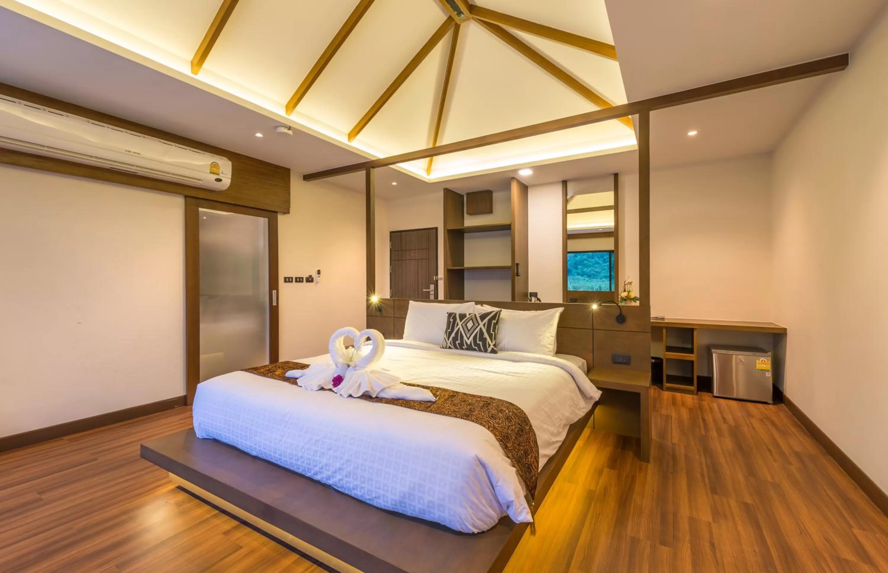 Bed in Cher​mantra​ Aonang​ Resort & Pool​ Suite