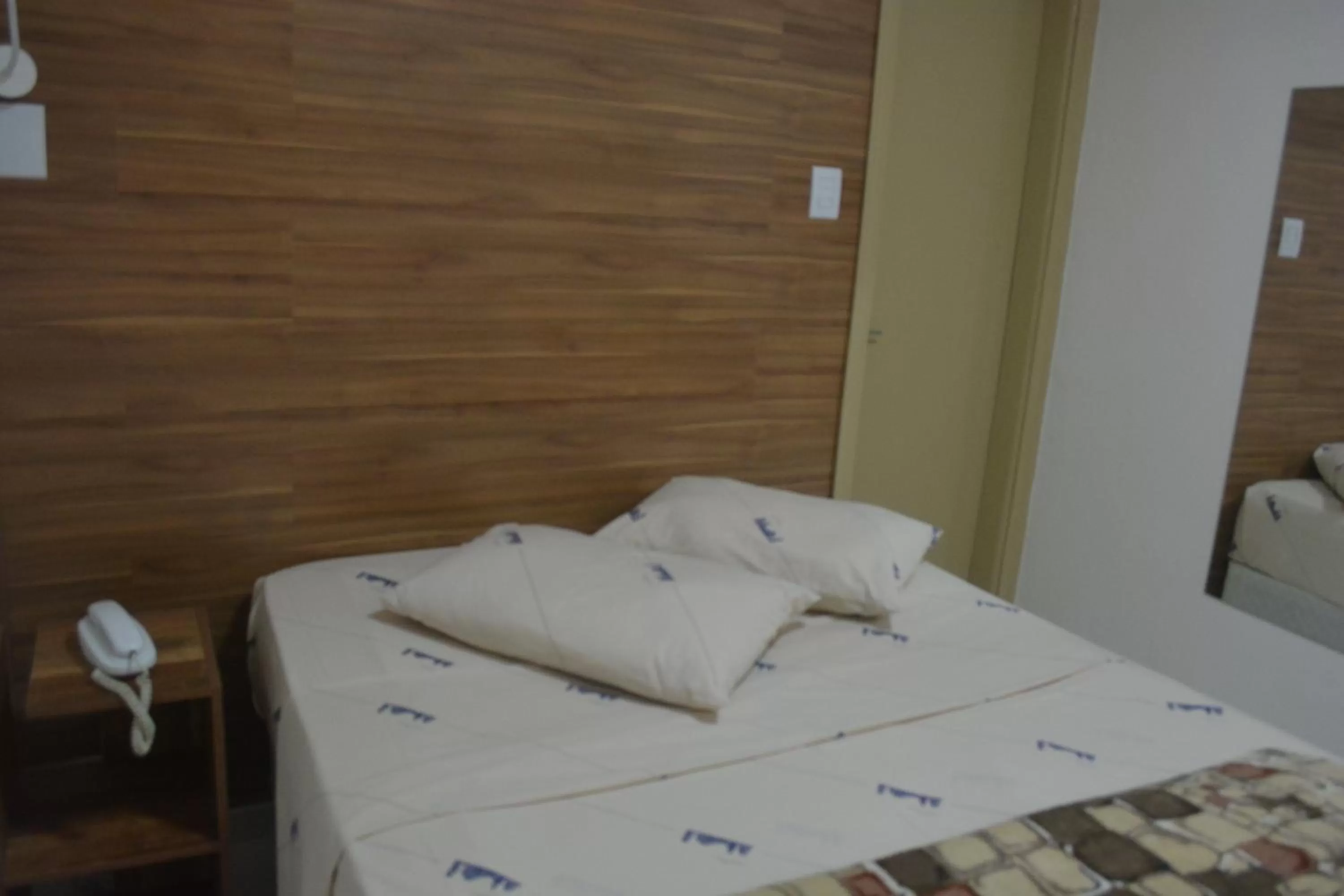 Bed in New Point Hotel