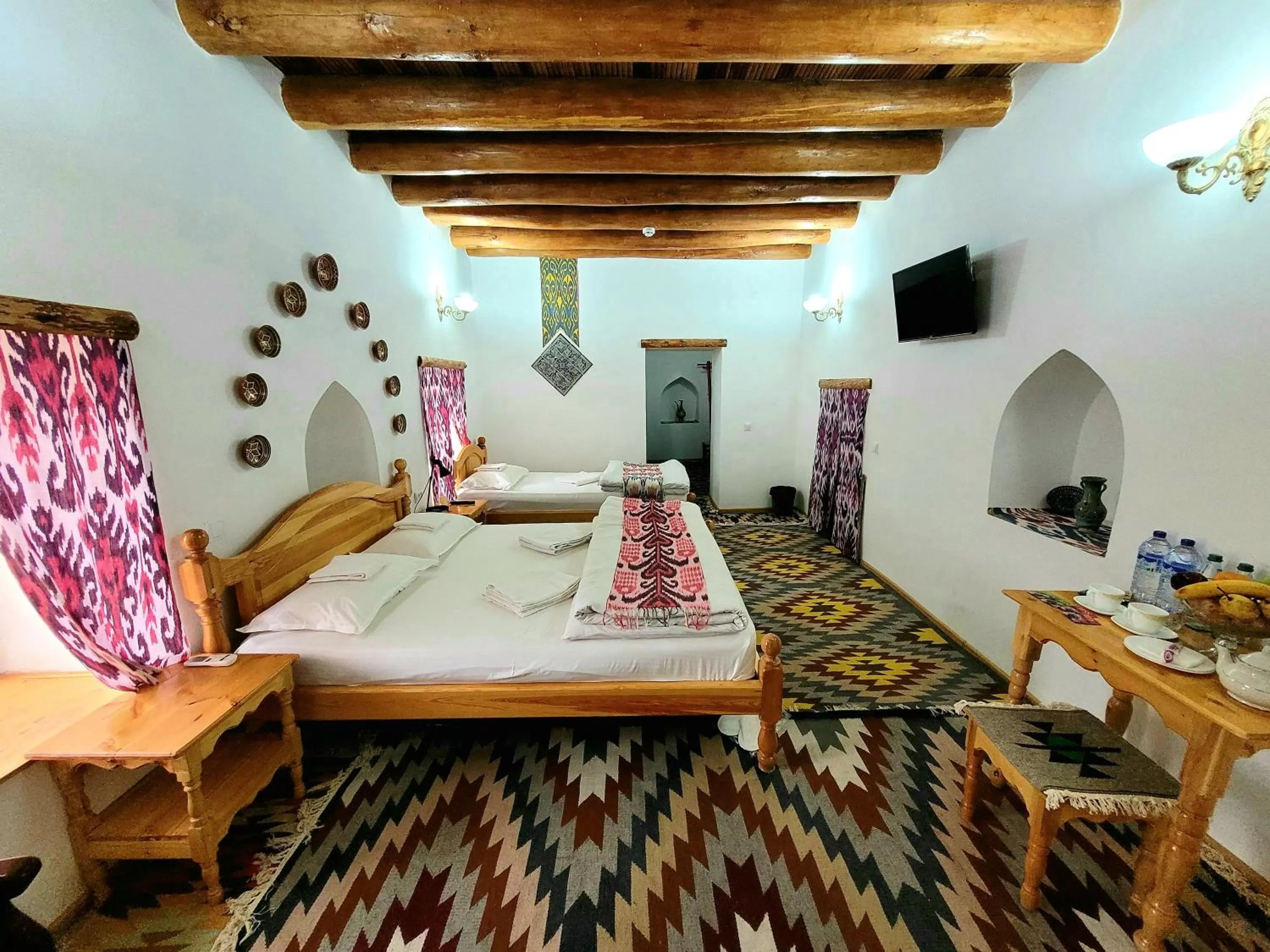 Bed in madrasah Polvon-Qori boutique hotel