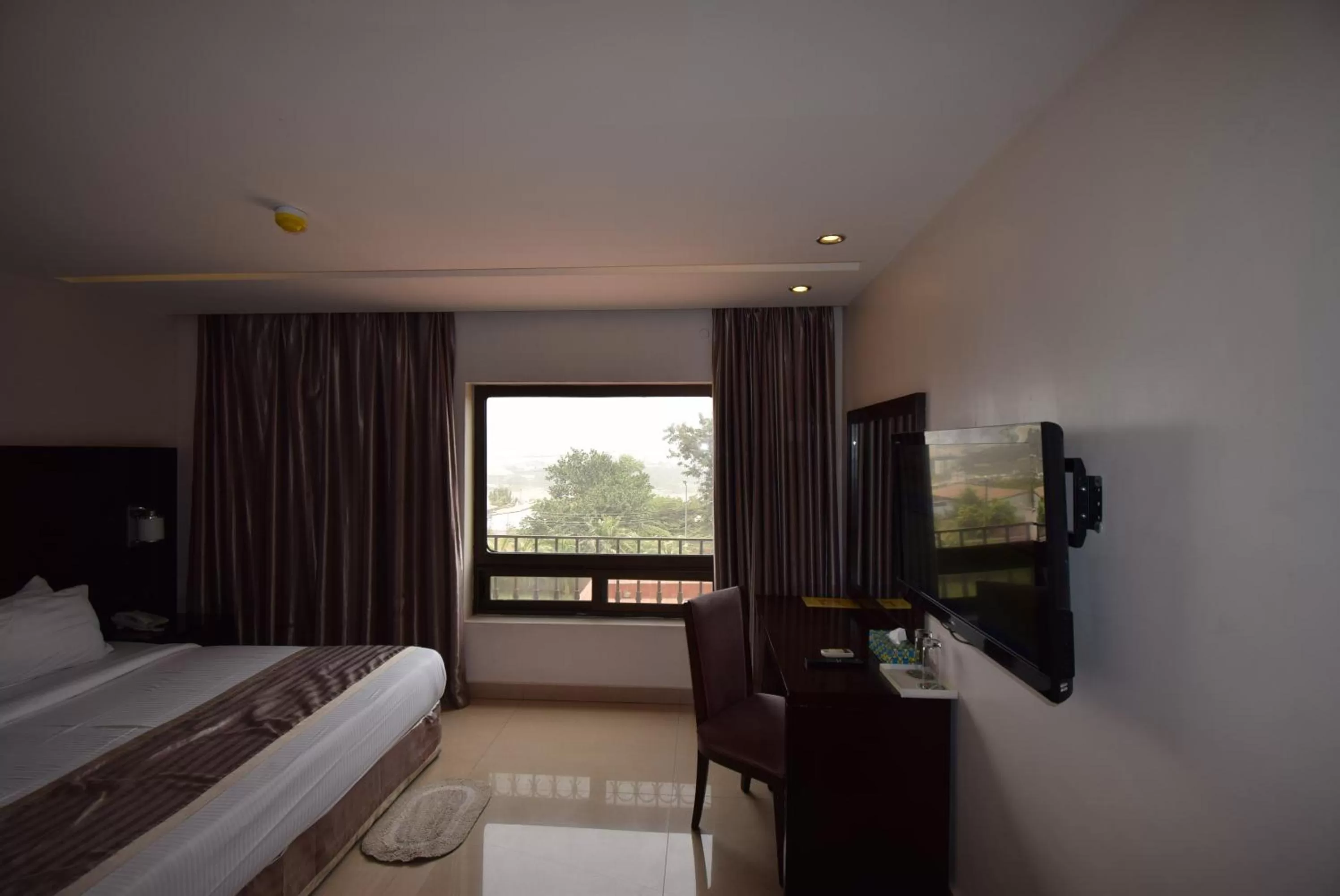 Photo of the whole room, TV/Entertainment Center in Noble House Hotel