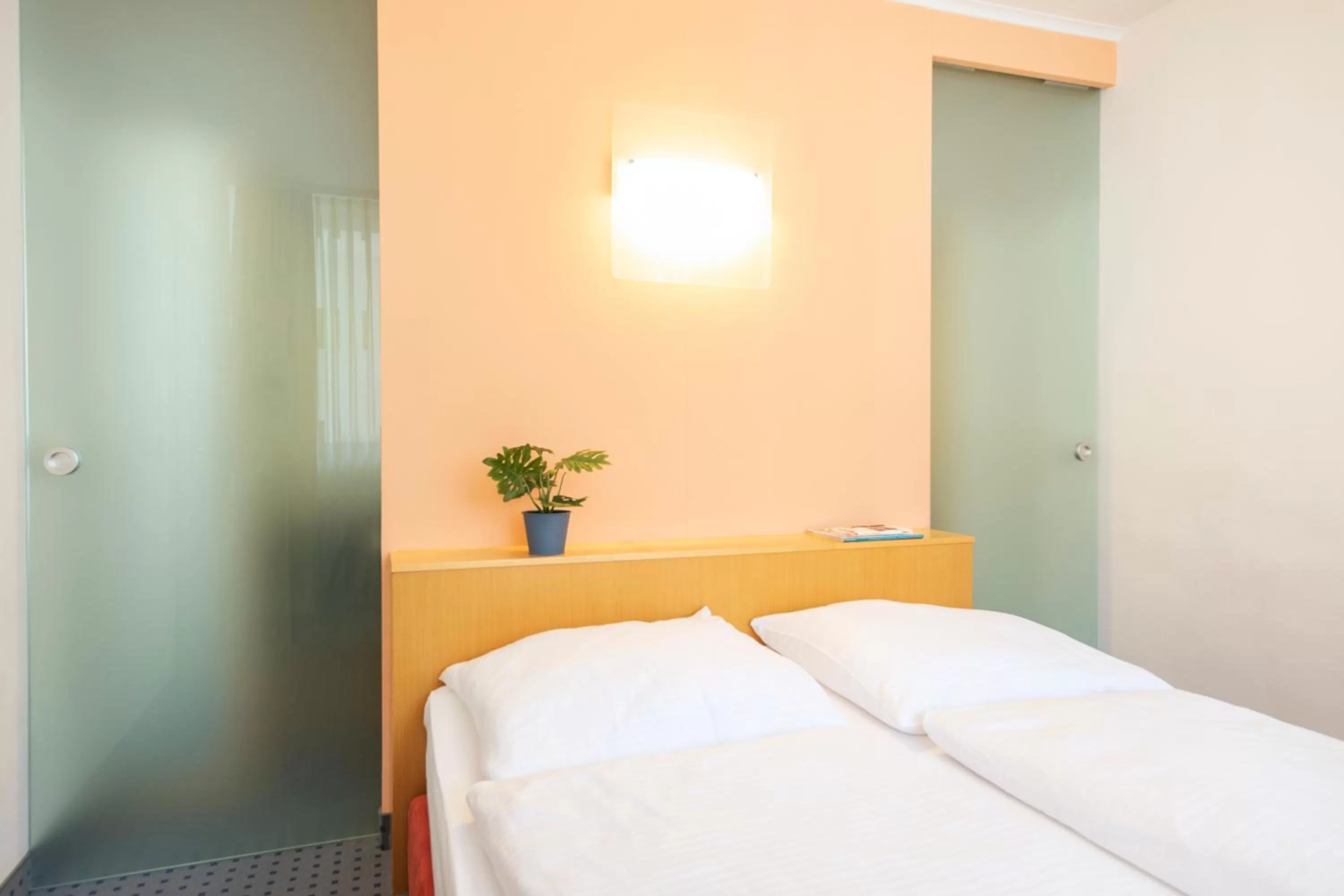 Photo of the whole room, Bed in ACHAT Hotel Suhl