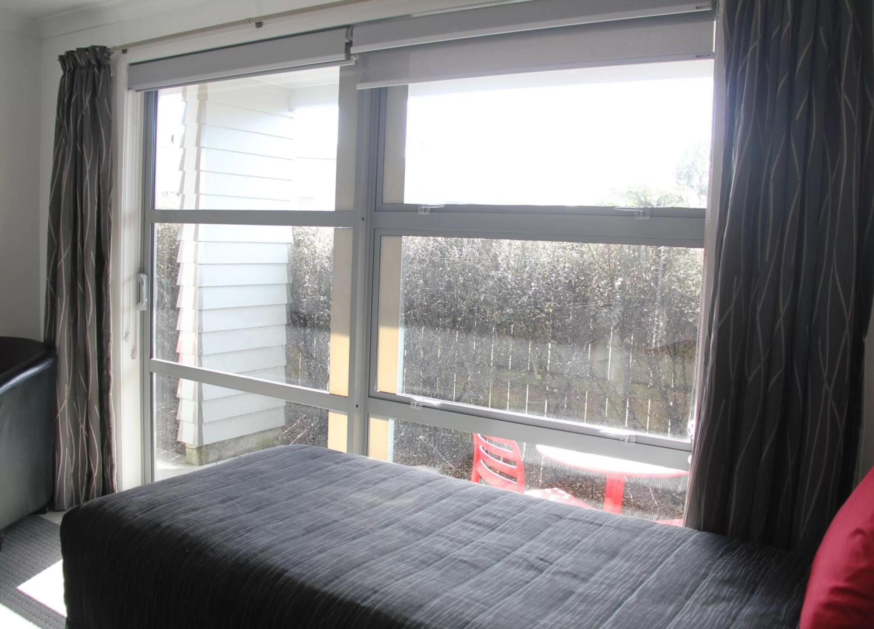 View (from property/room), Bed in Pukekura Motor Lodge