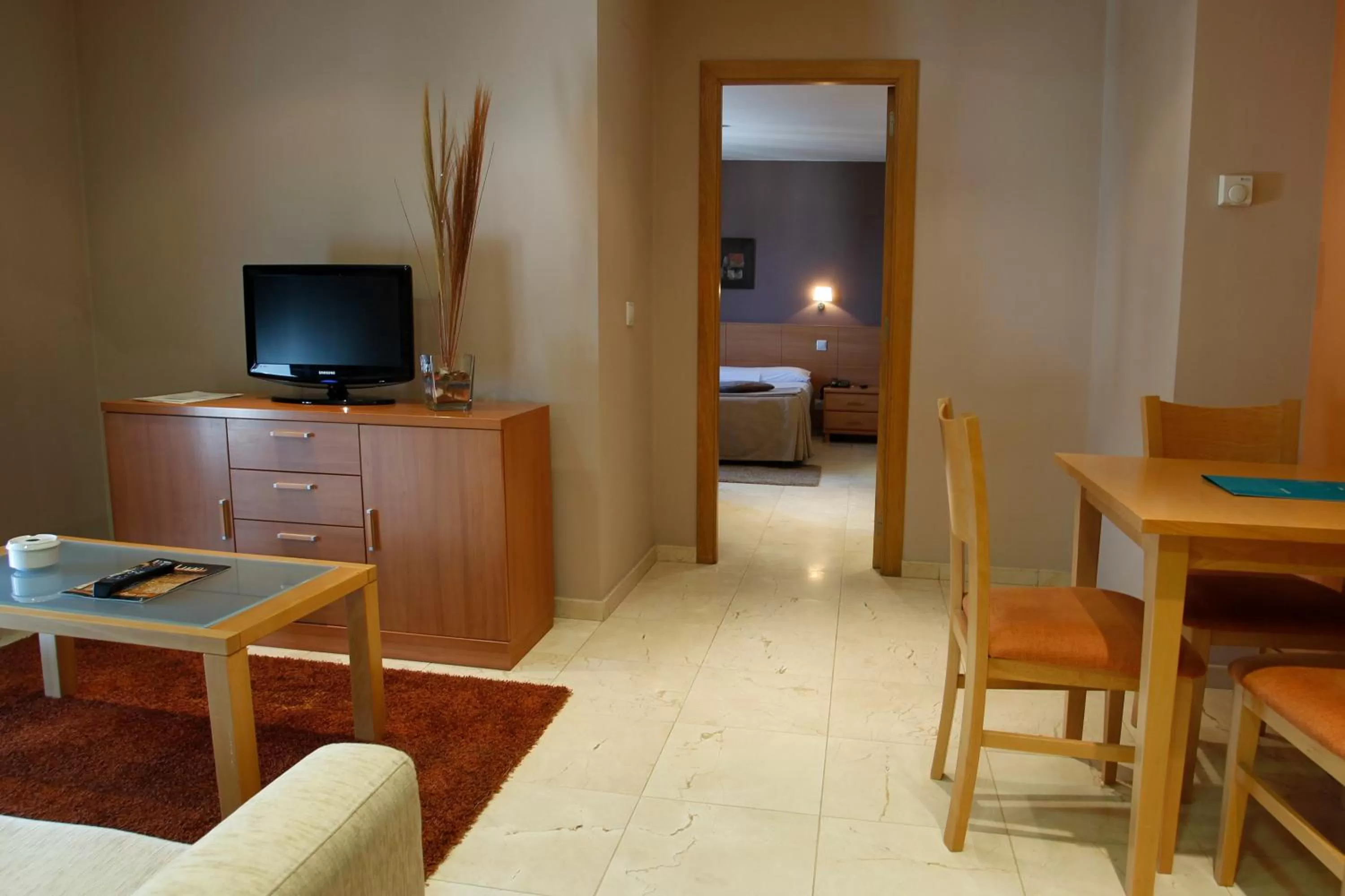 Living room, Bed in Apartamentos Ciudad de Lugo