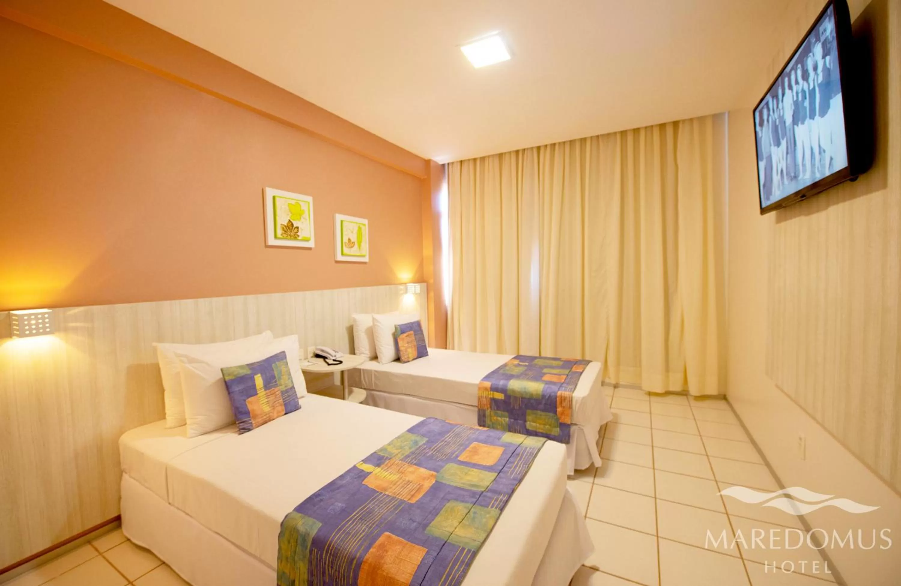 Bed in Maredomus Hotel