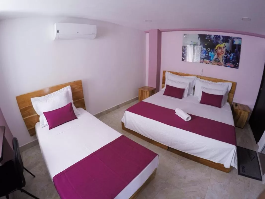 Bed in Kamaleb Farallones Hotel