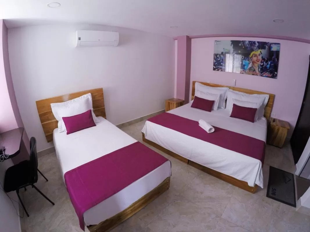 Bed in Kamaleb Farallones Hotel