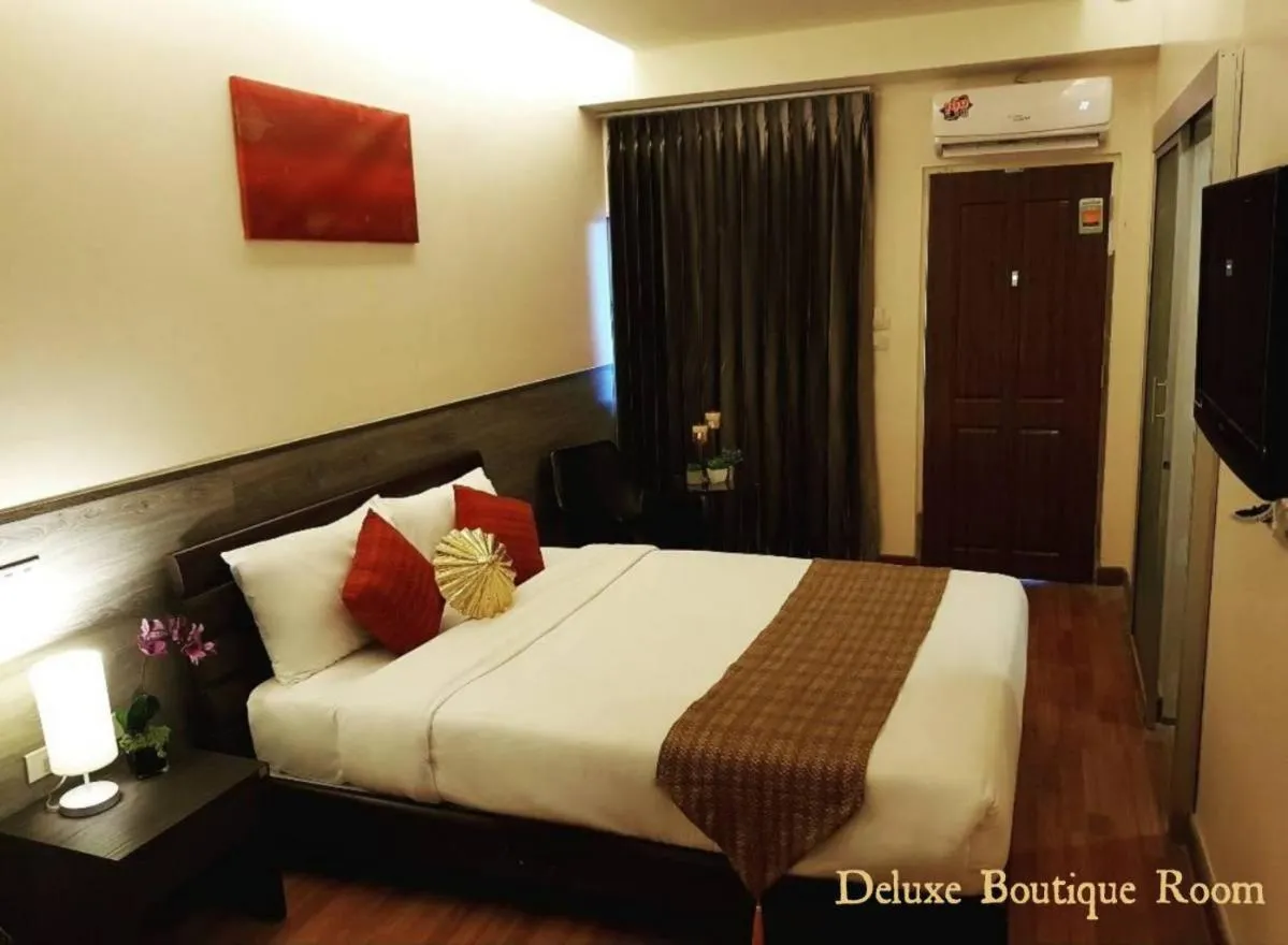 Bed in Maninarakorn Hotel