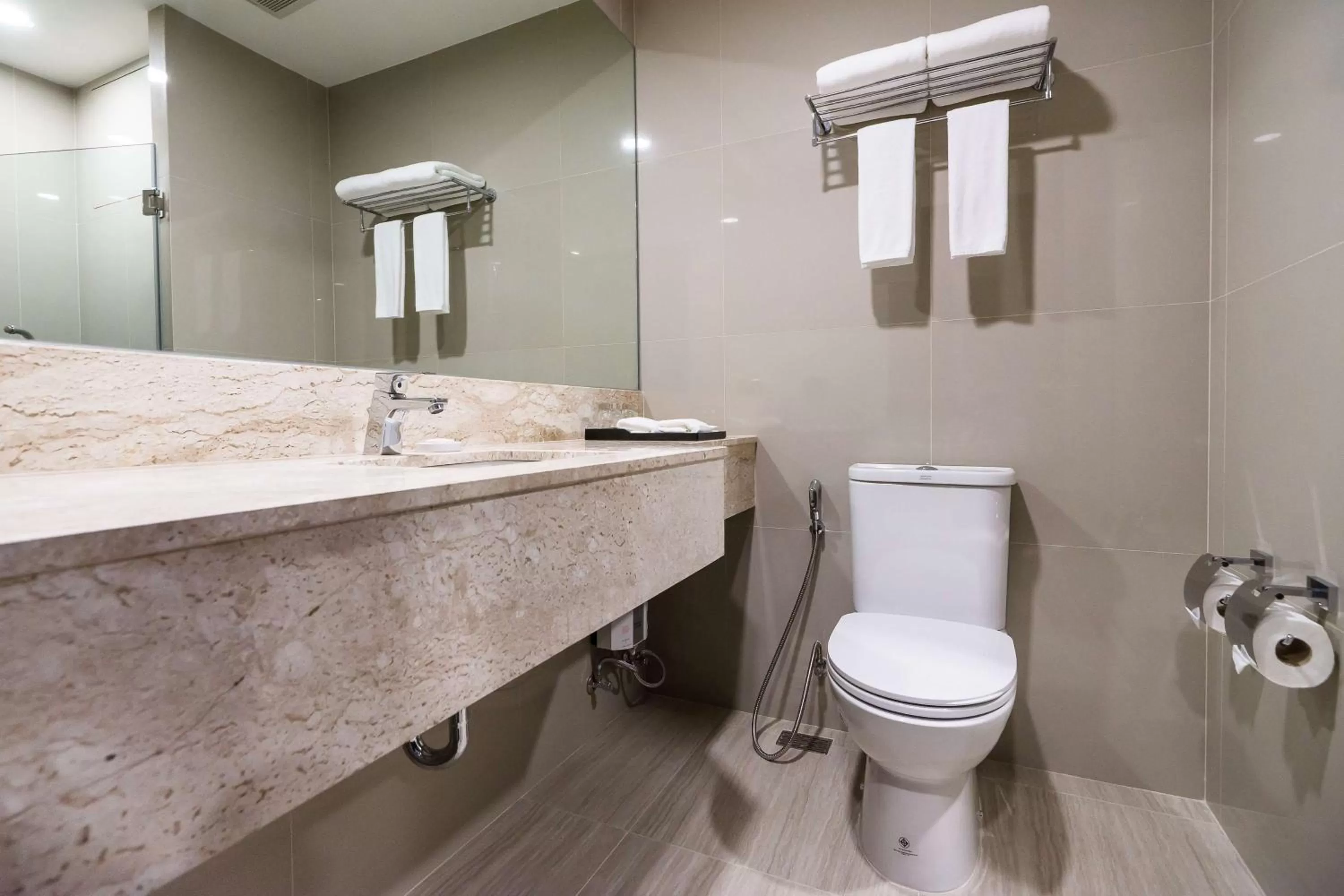 Bathroom in SureStay Plus by Best Western Sukhumvit 2