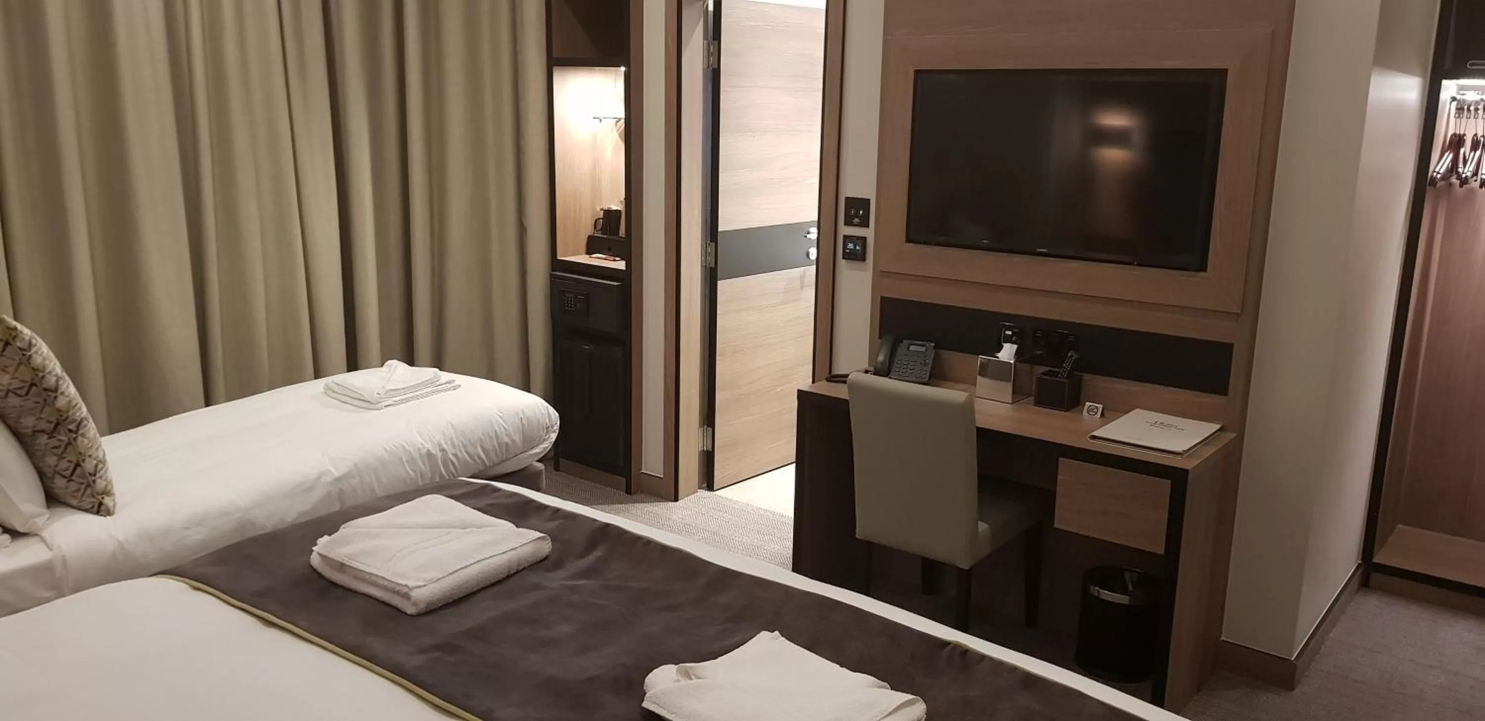 Bed in Merit Kensington Hotel