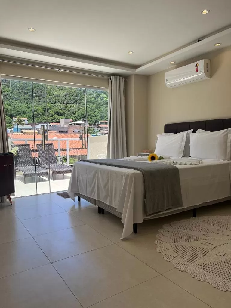 Bed in Pousada Arraial Tropical