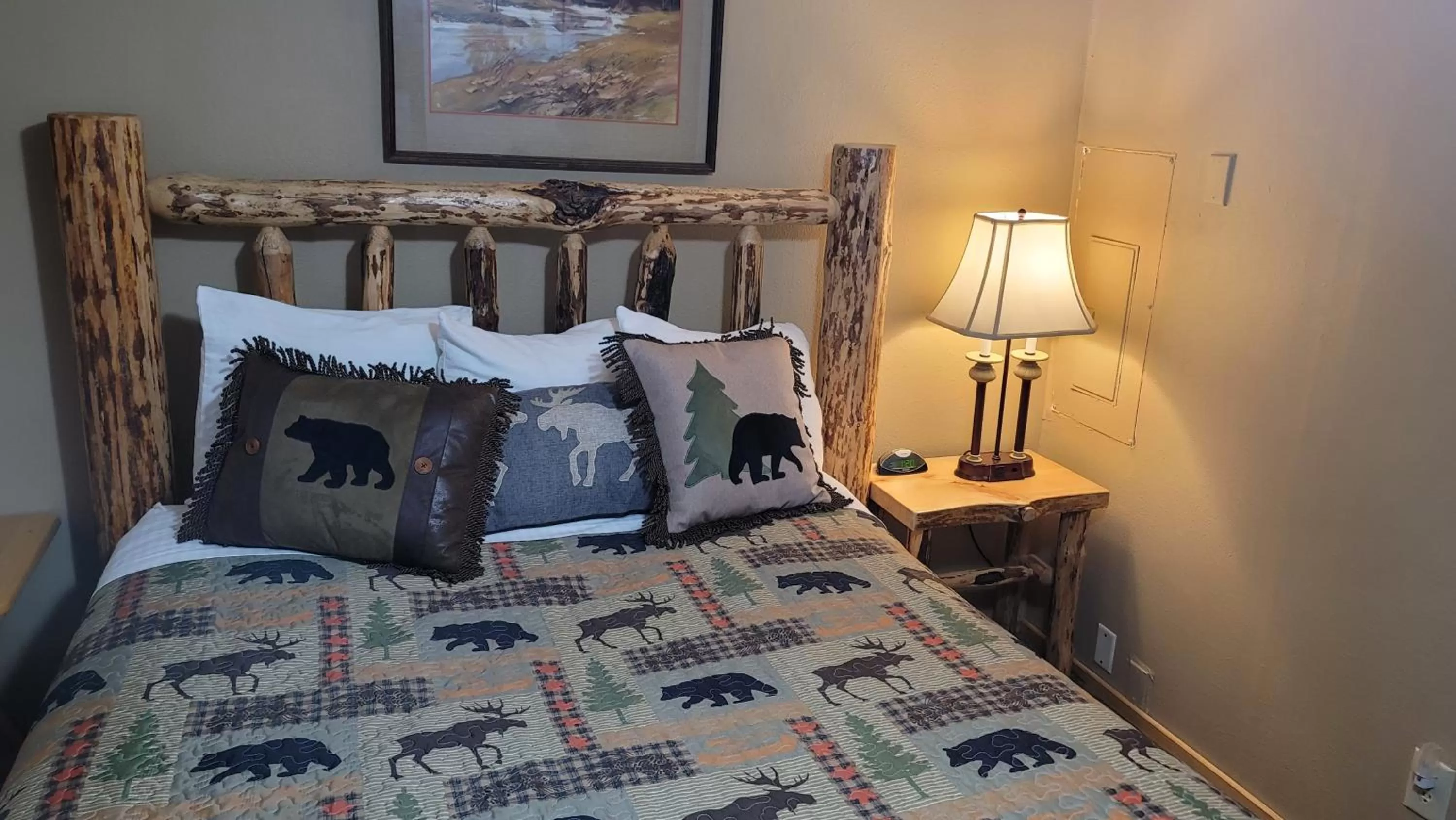 Bed in Riverfront Motel & Cabins