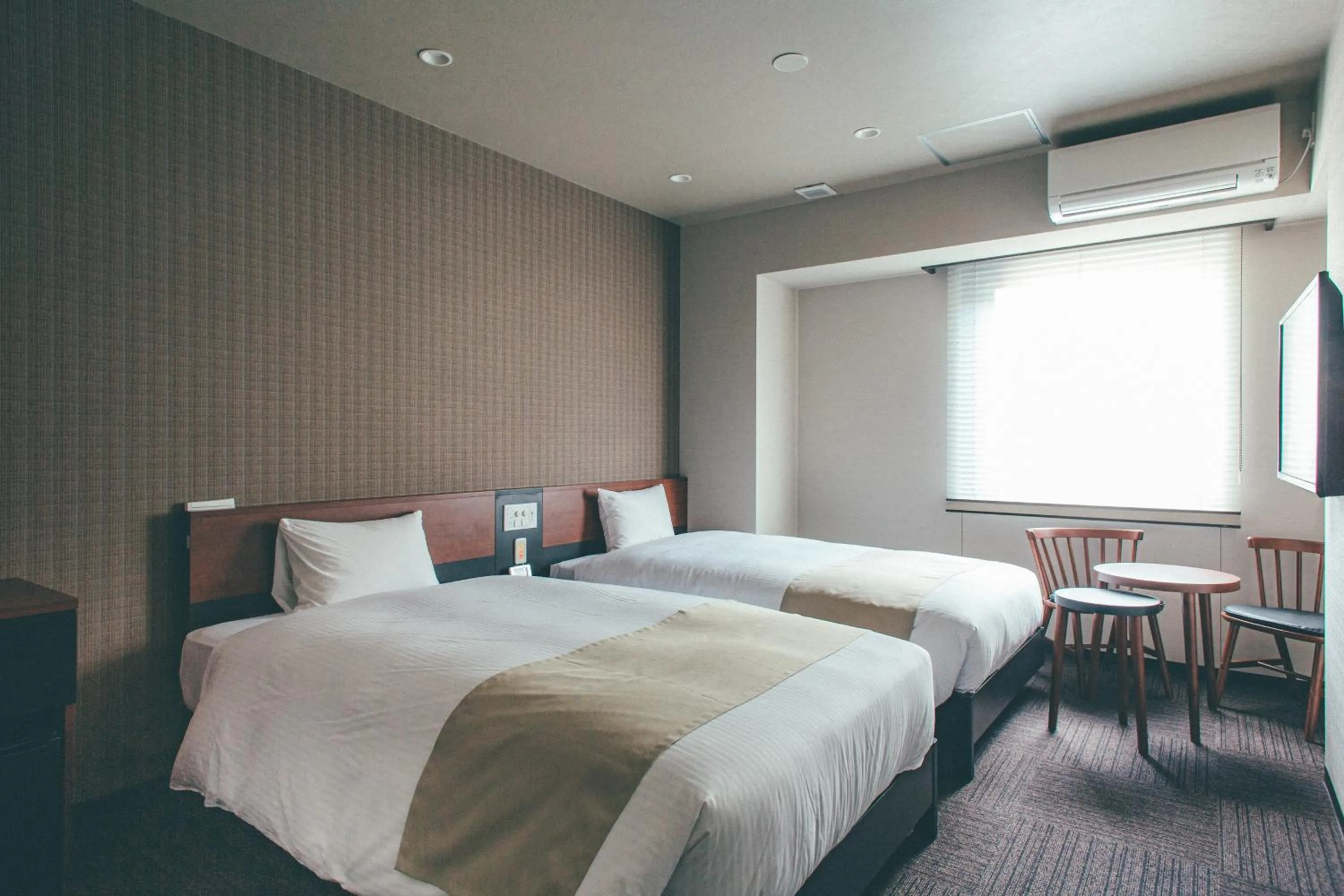 Bed in Hotel Kuretakeso Takayama Ekimae