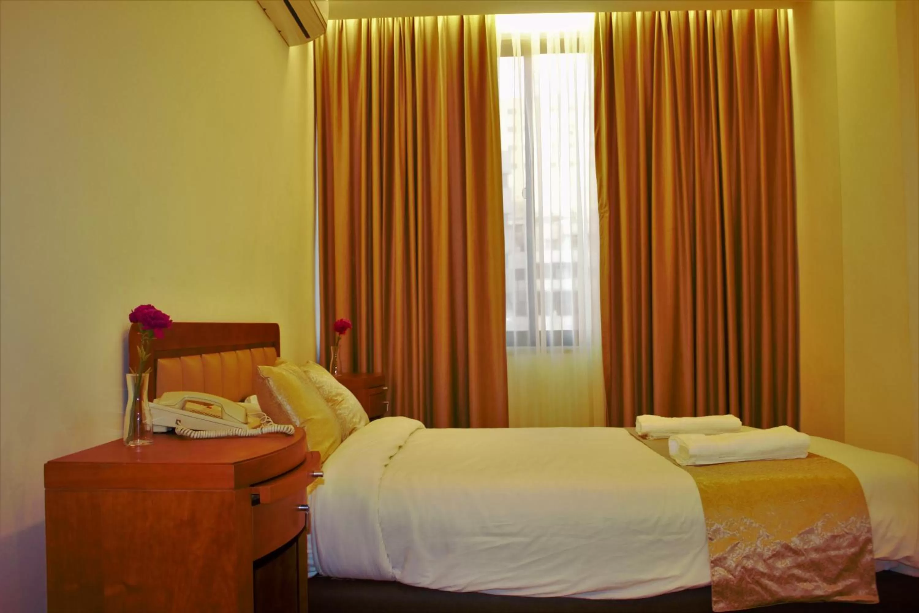 Bed in New MerryLand Hotel