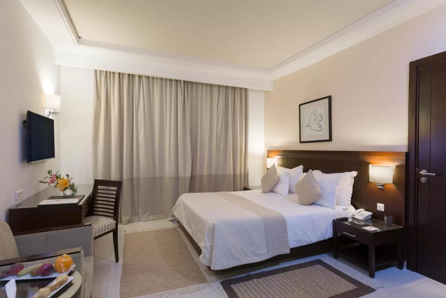 Bed in Le Corail Suites Hotel