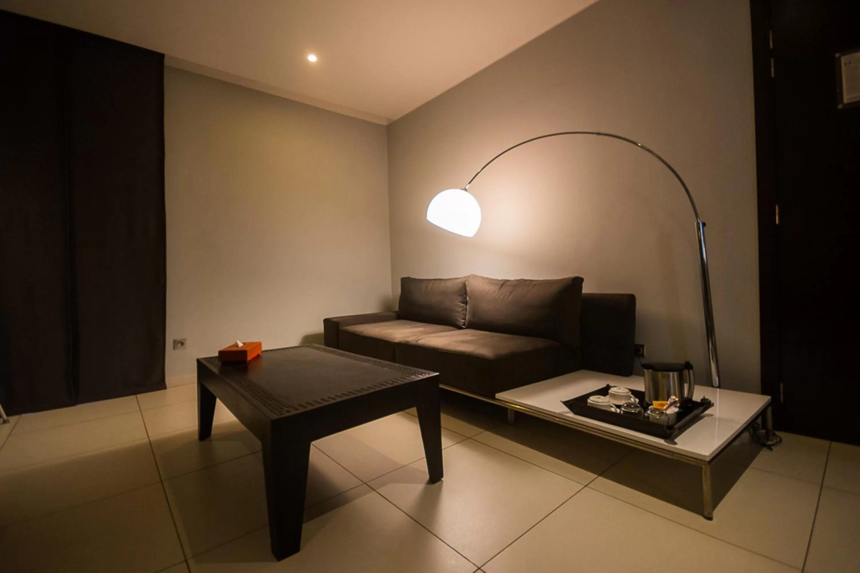 Seating area, Bed in Rysara Hotel