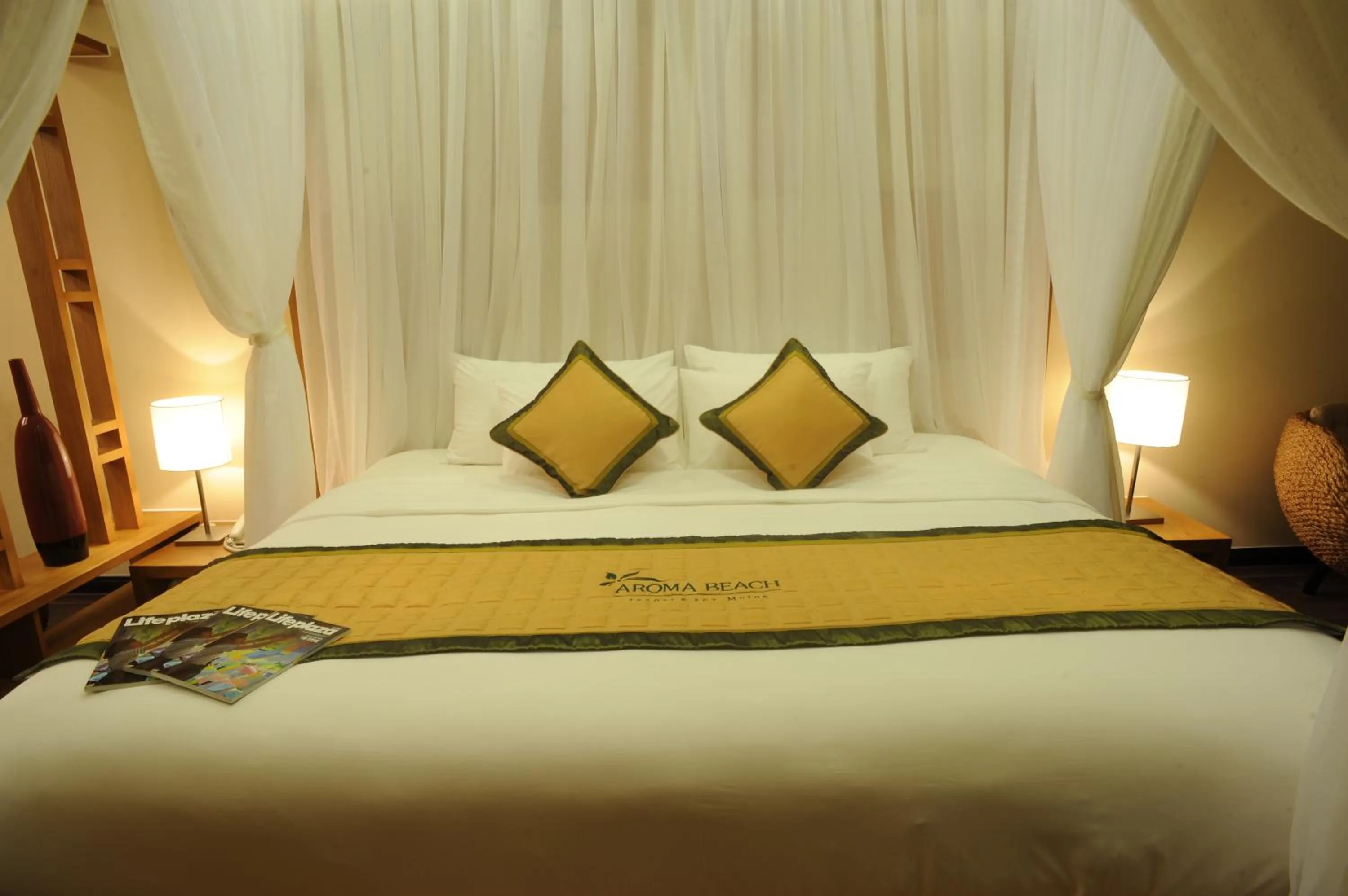 Bed in Aroma Beach Resort and Spa