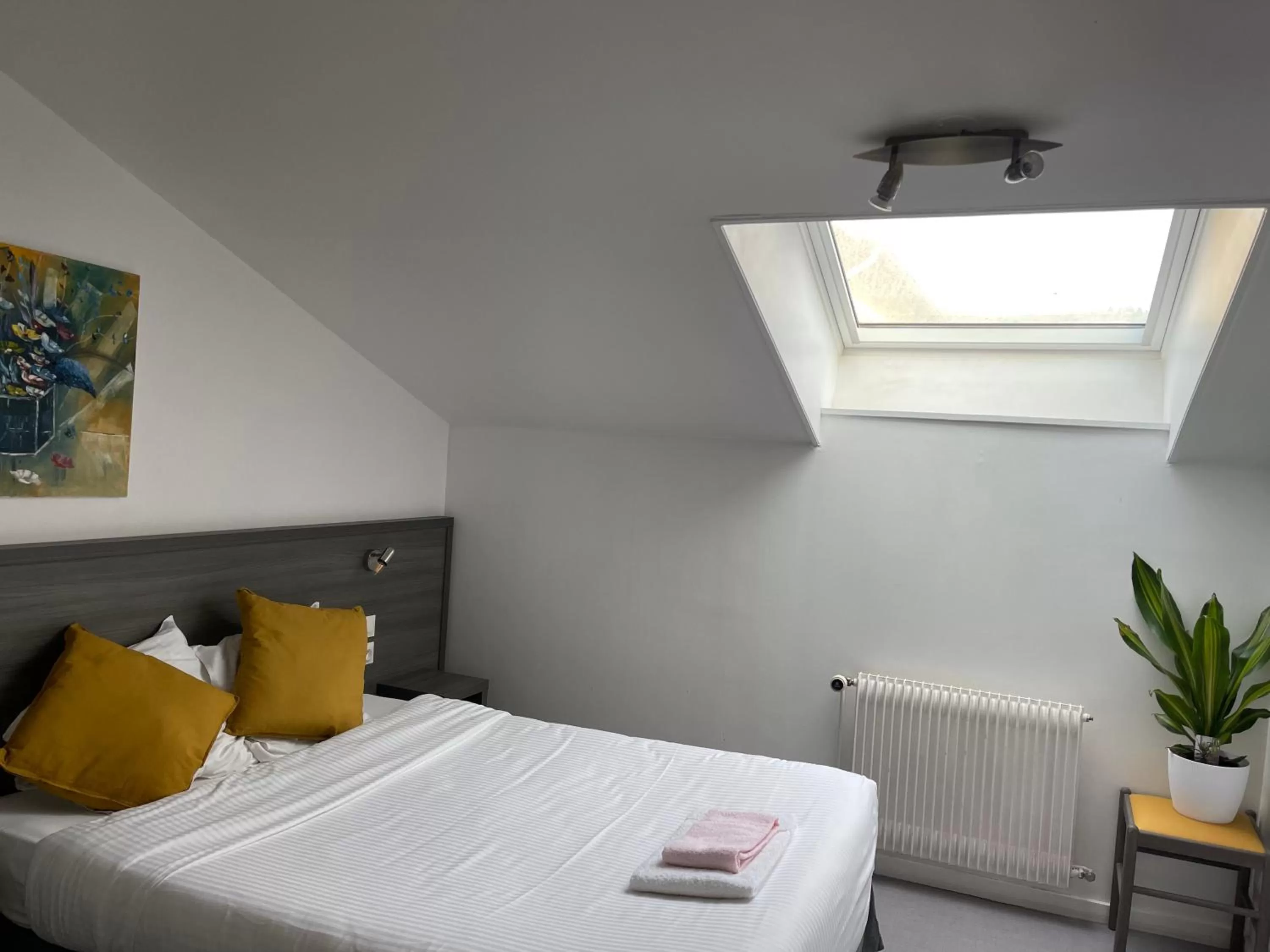 Bed in Logis Hôtel Vuillot