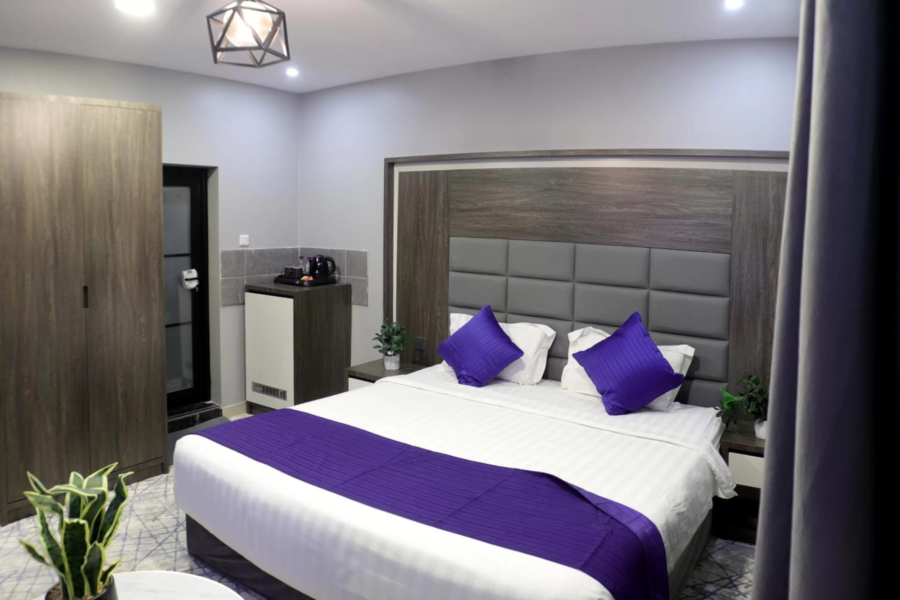 Bed in Maskan Al Dyafah Hotel Apartments