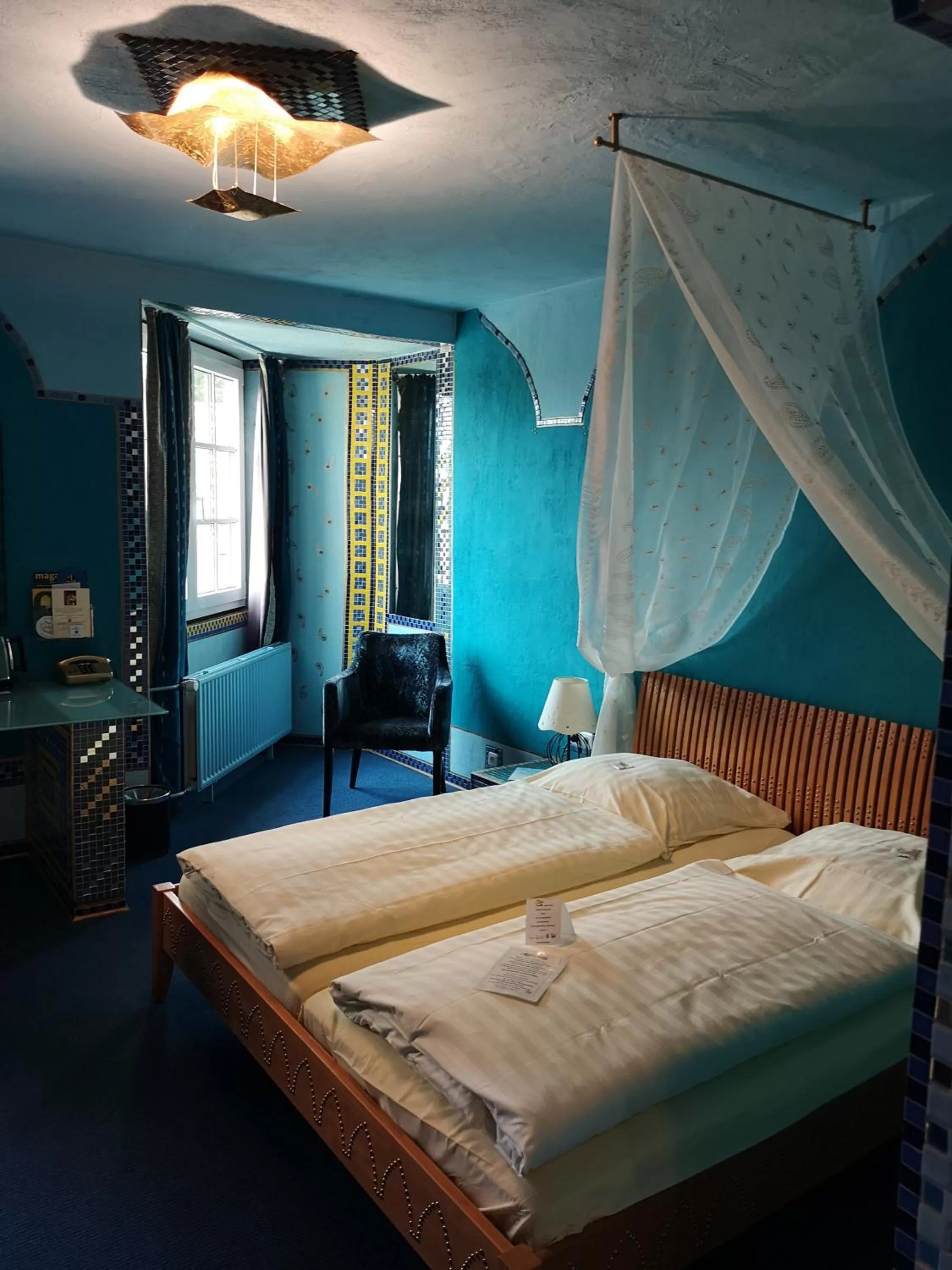 Bed in Hotel Goldflair am Rathaus