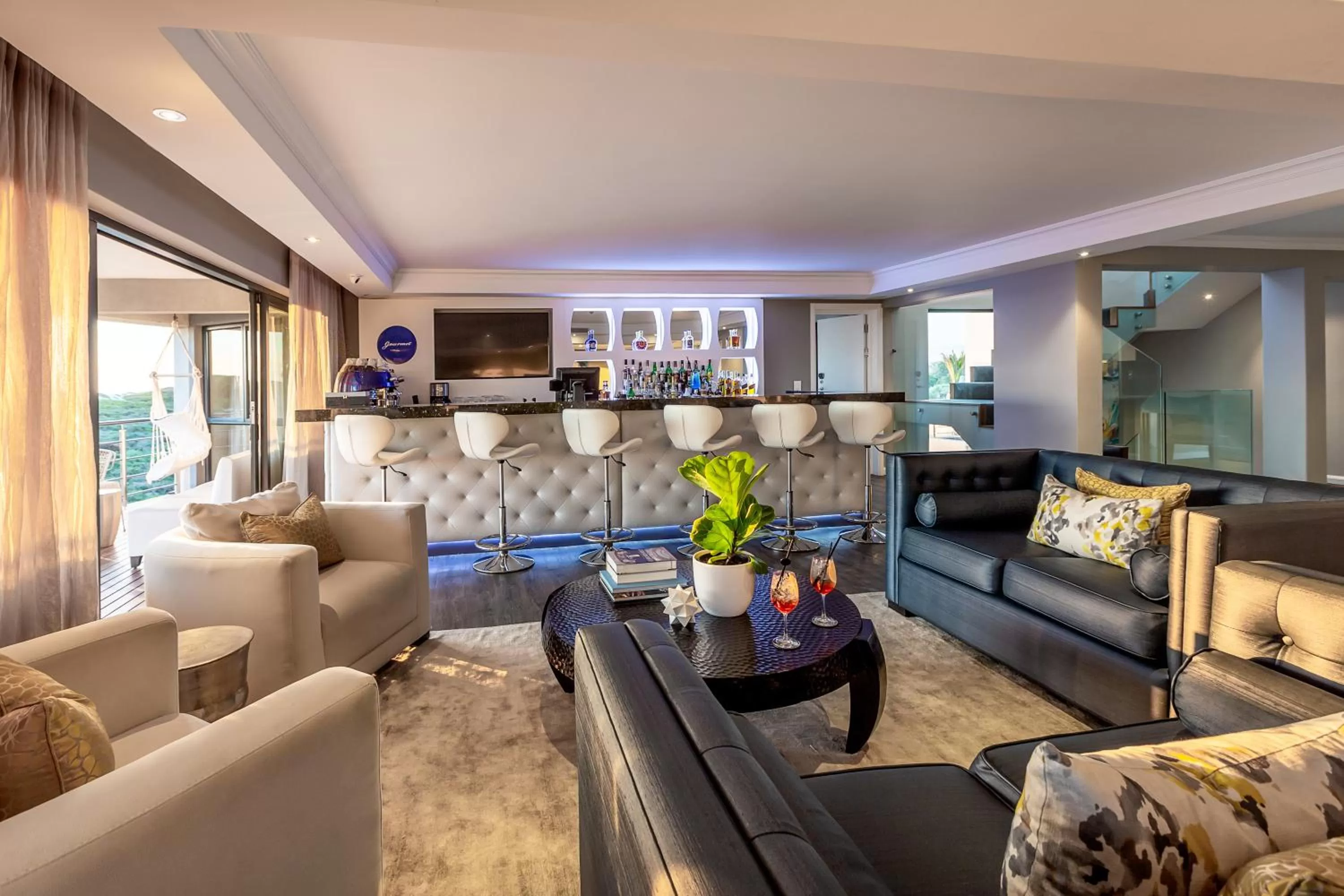 Communal lounge/ TV room in Bliss Boutique Hotel