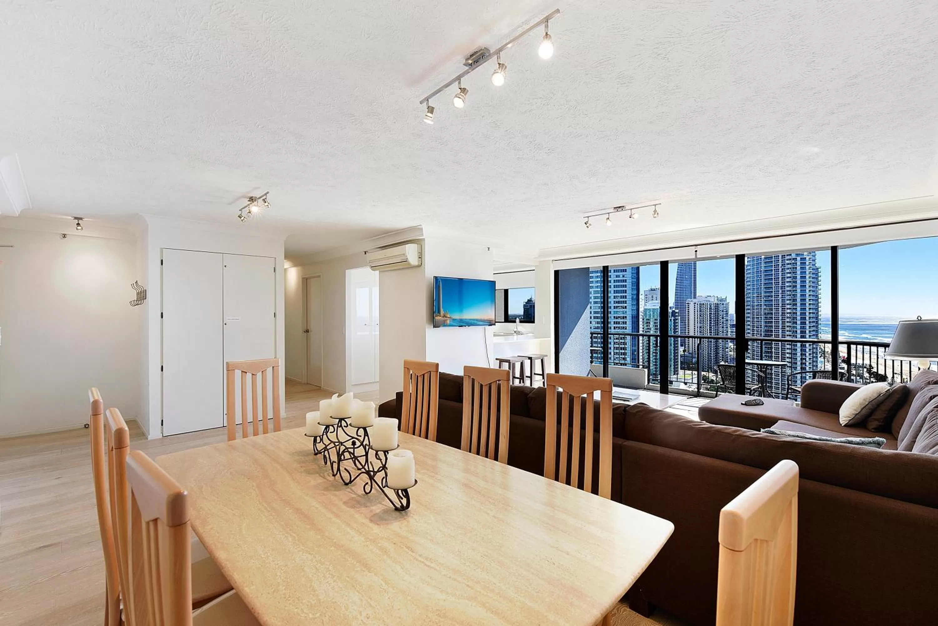 Dining area in Surfers Century Oceanside Apartments