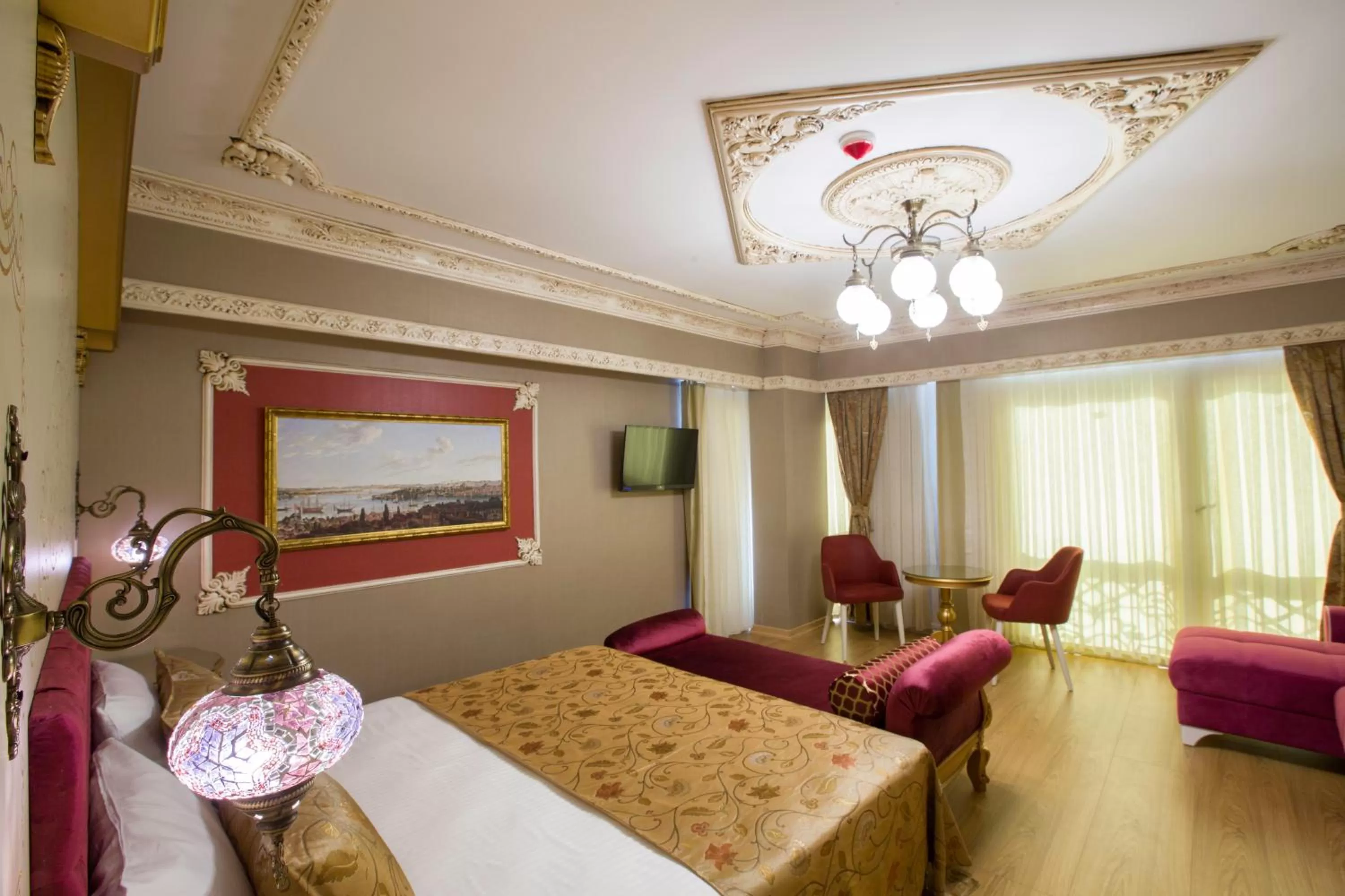 Bed in Empire Suite Hotel