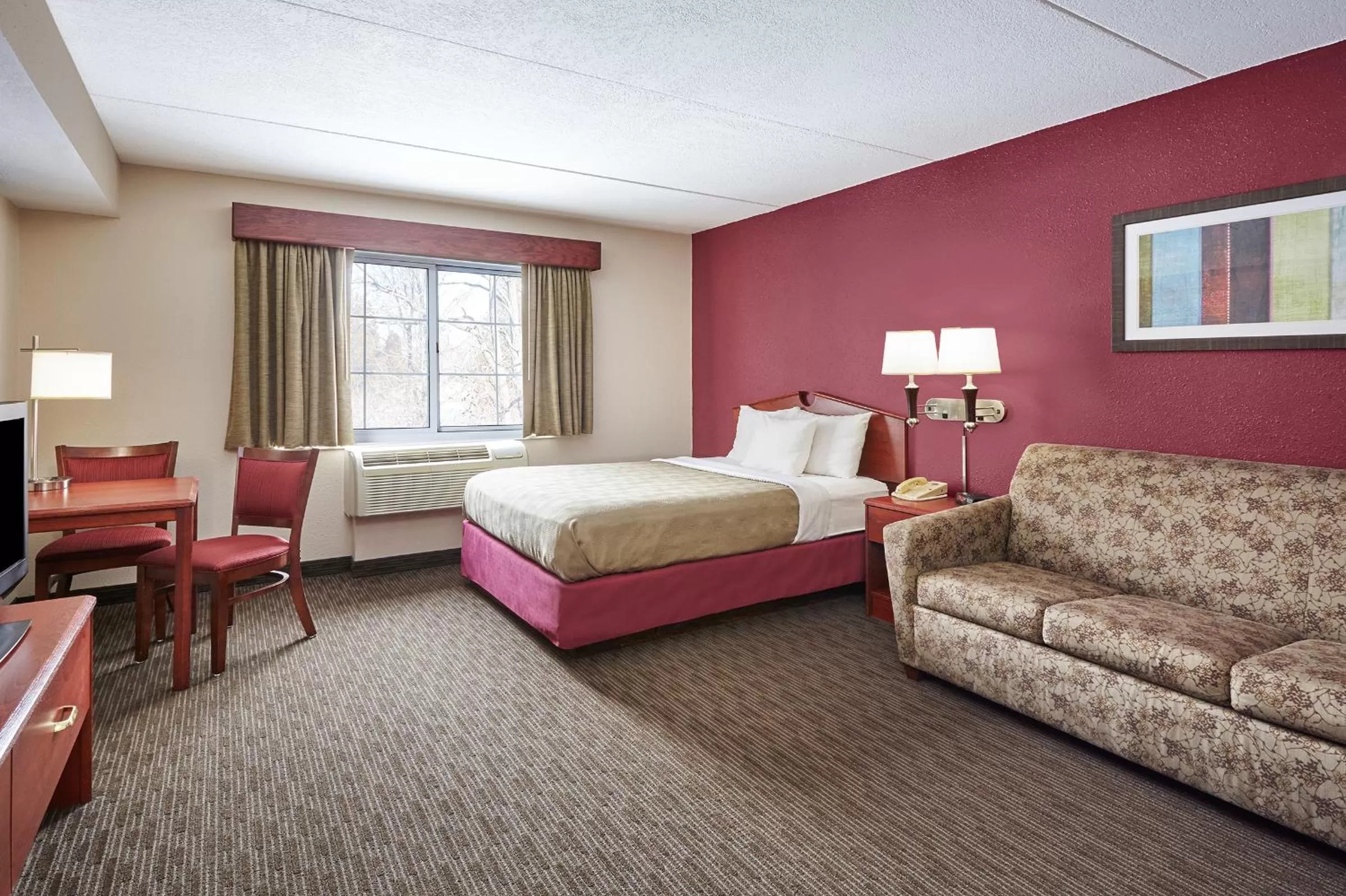 Bed in AmericInn by Wyndham Douglas/Saugatuck