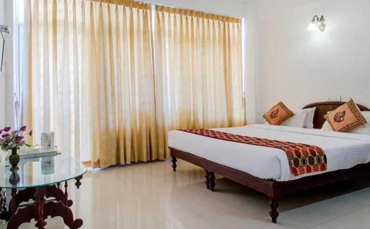 Bed in Swapnatheeram Beach Resort