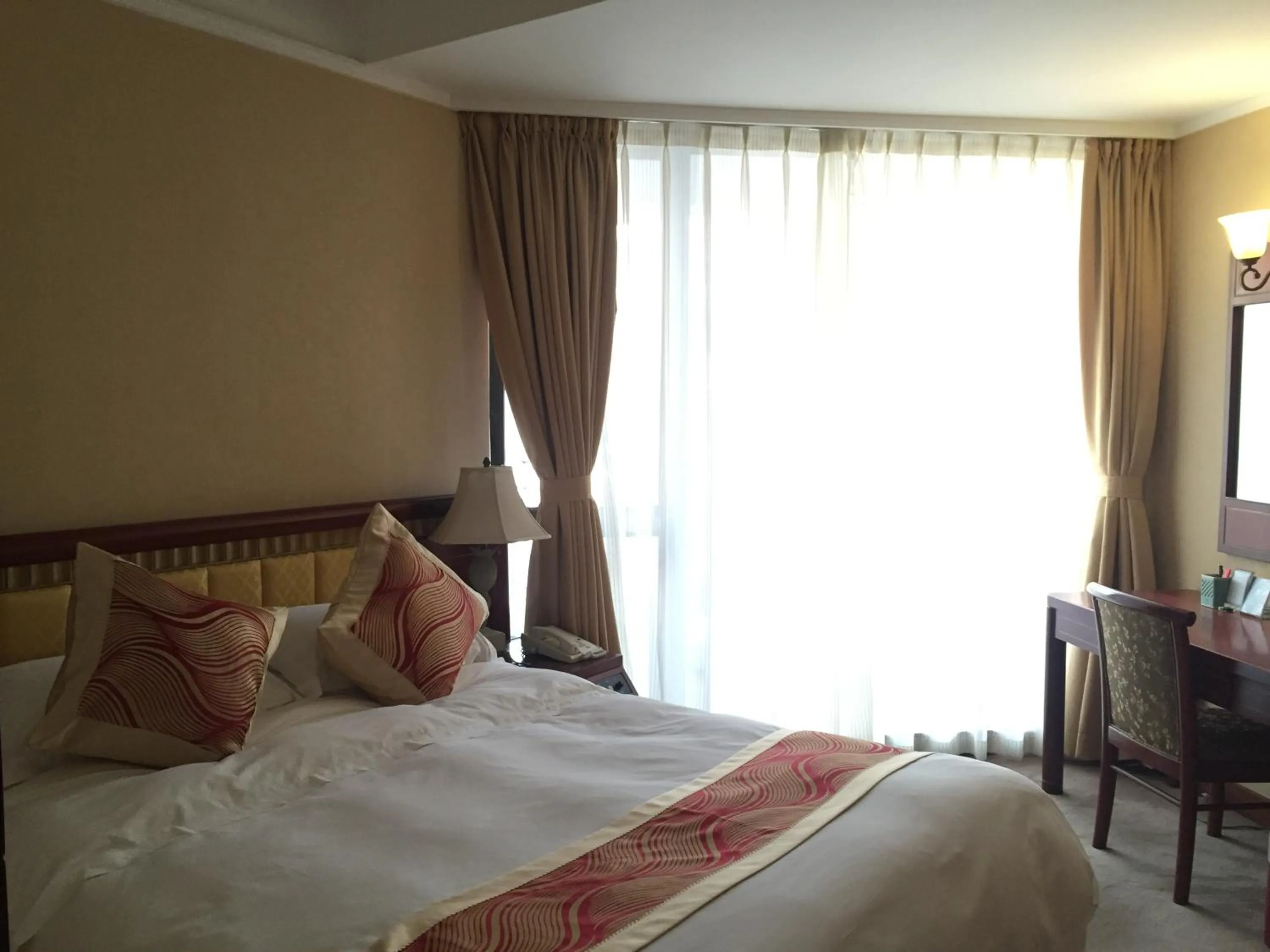Bed in Huiquan Dynasty Hotel Qingdao