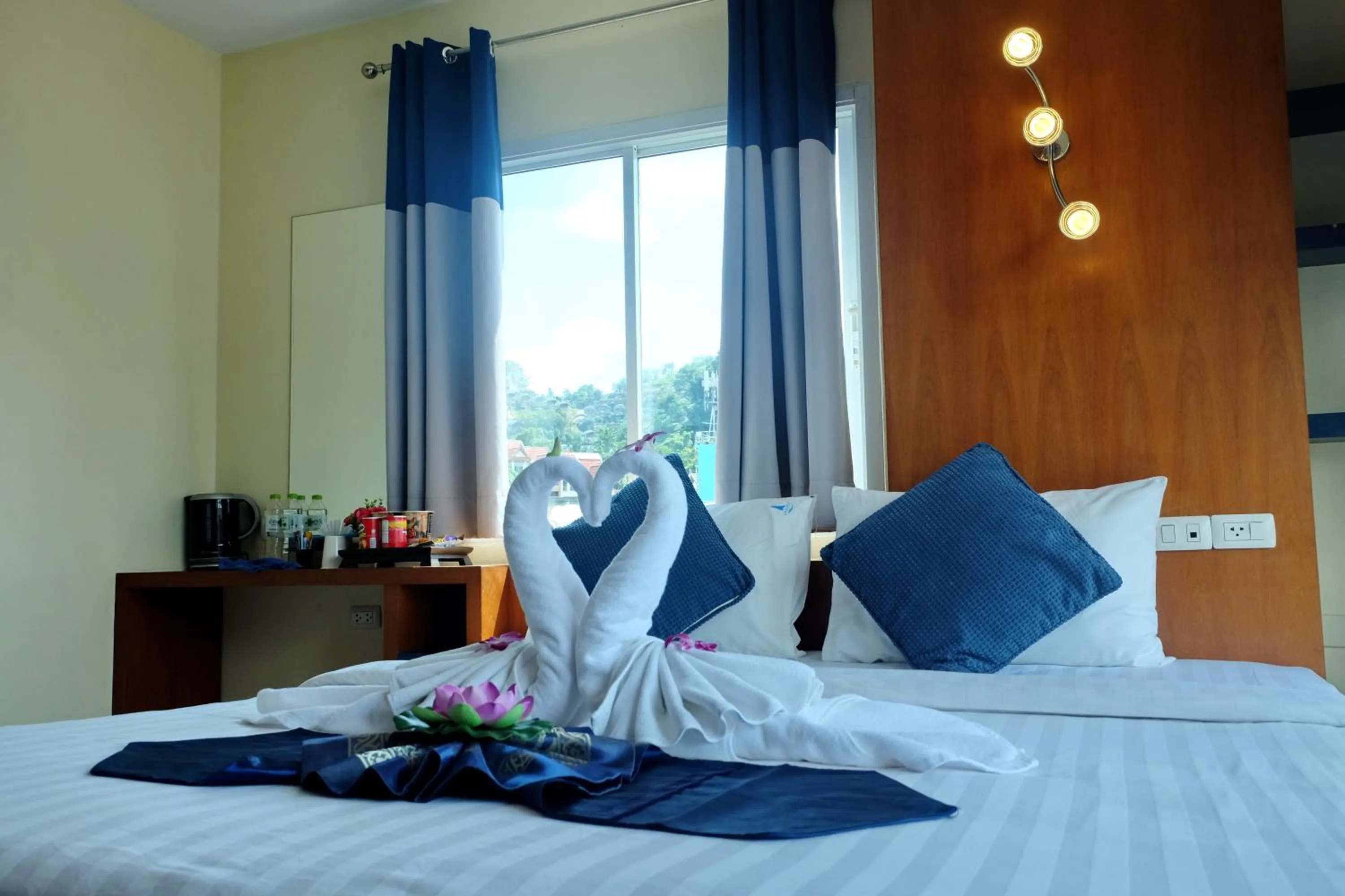 Bed in Calypso Patong Hotel