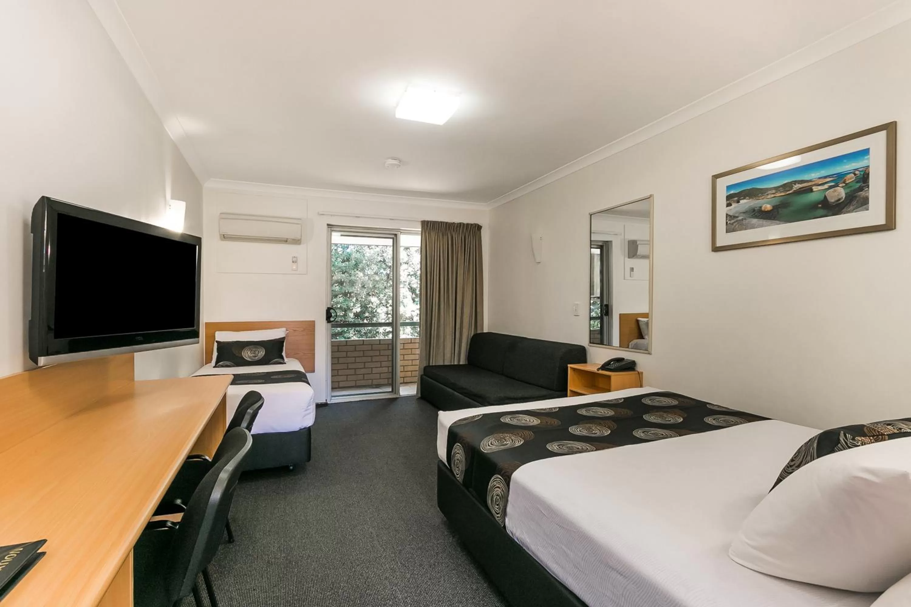 Bed in Flag Motor Lodge