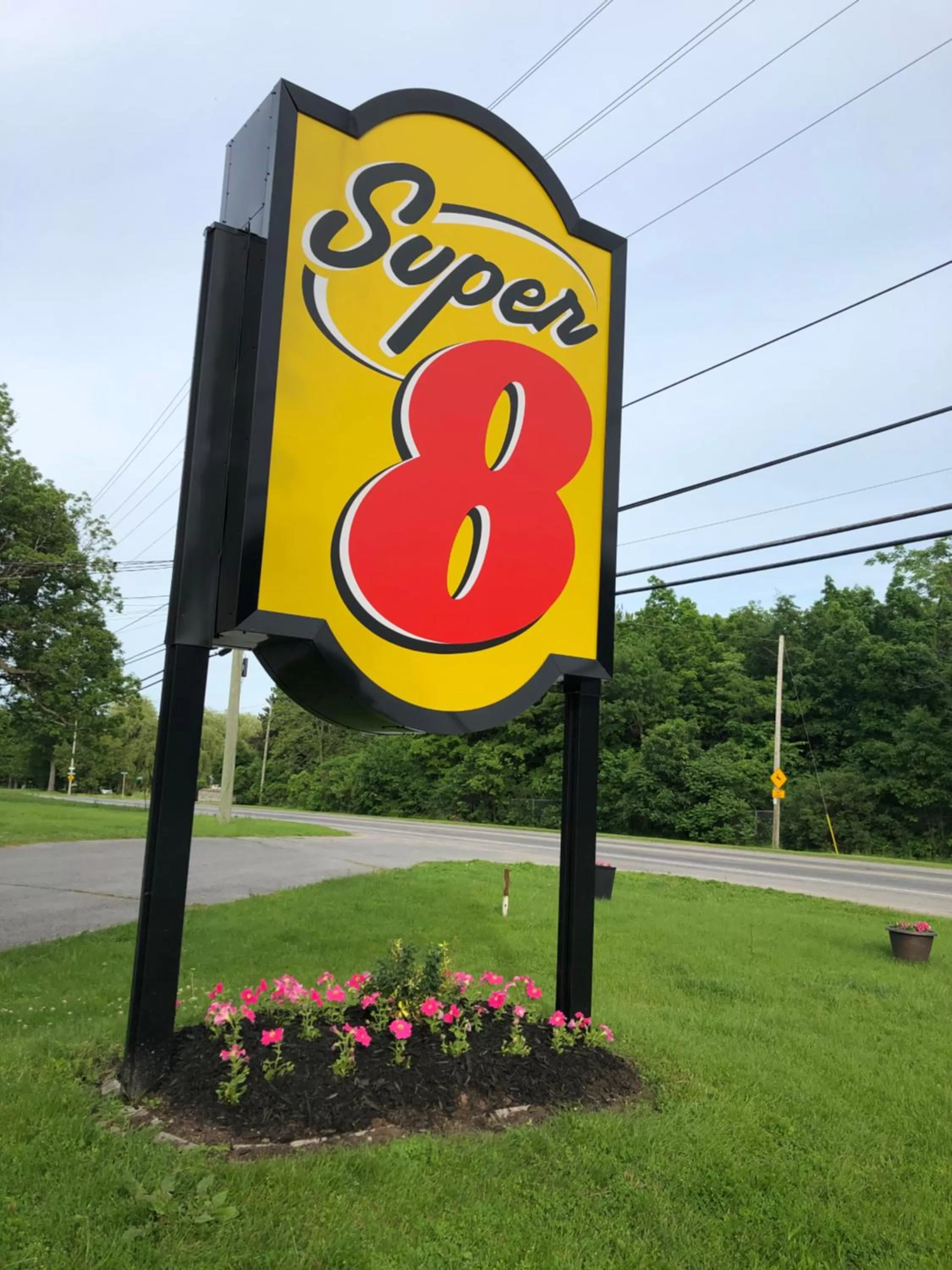 Property logo or sign in Super 8 by Wyndham Kingston