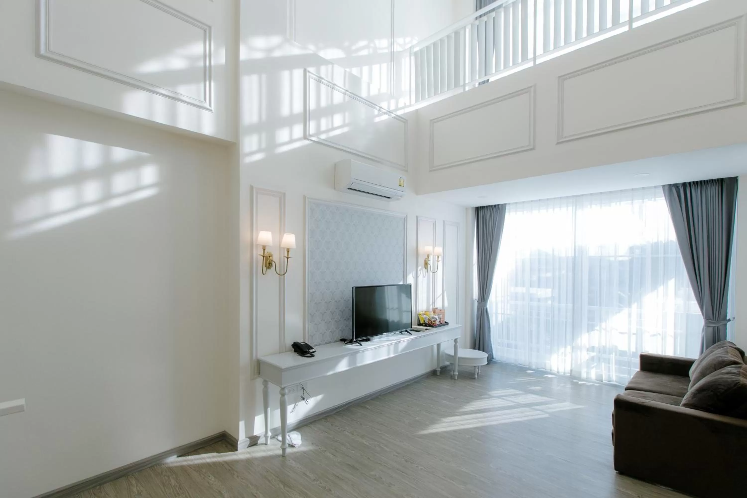 Bed in De Hug Hotel & Residence