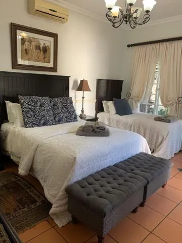 Bed in A Tapestry Garden Guest House