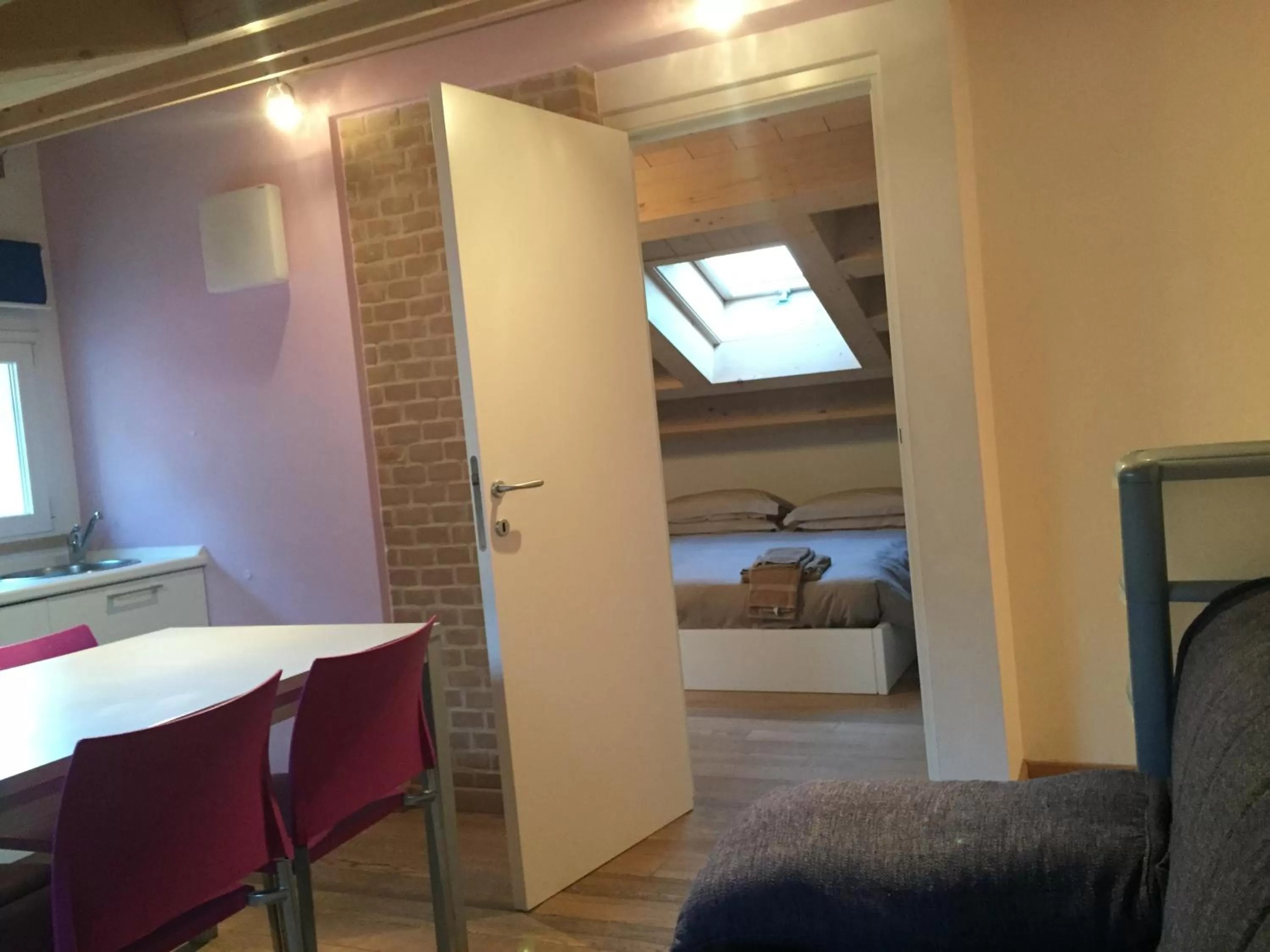 Living room, Bed in Residence La Nave