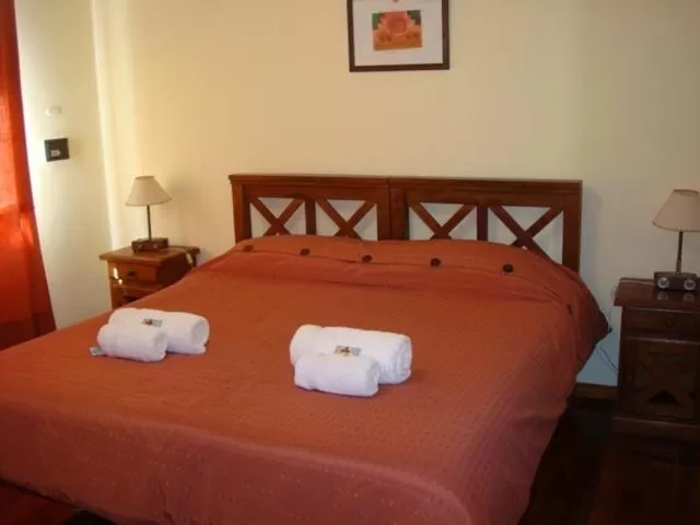 Bed in Hosteria Miyazato Inn