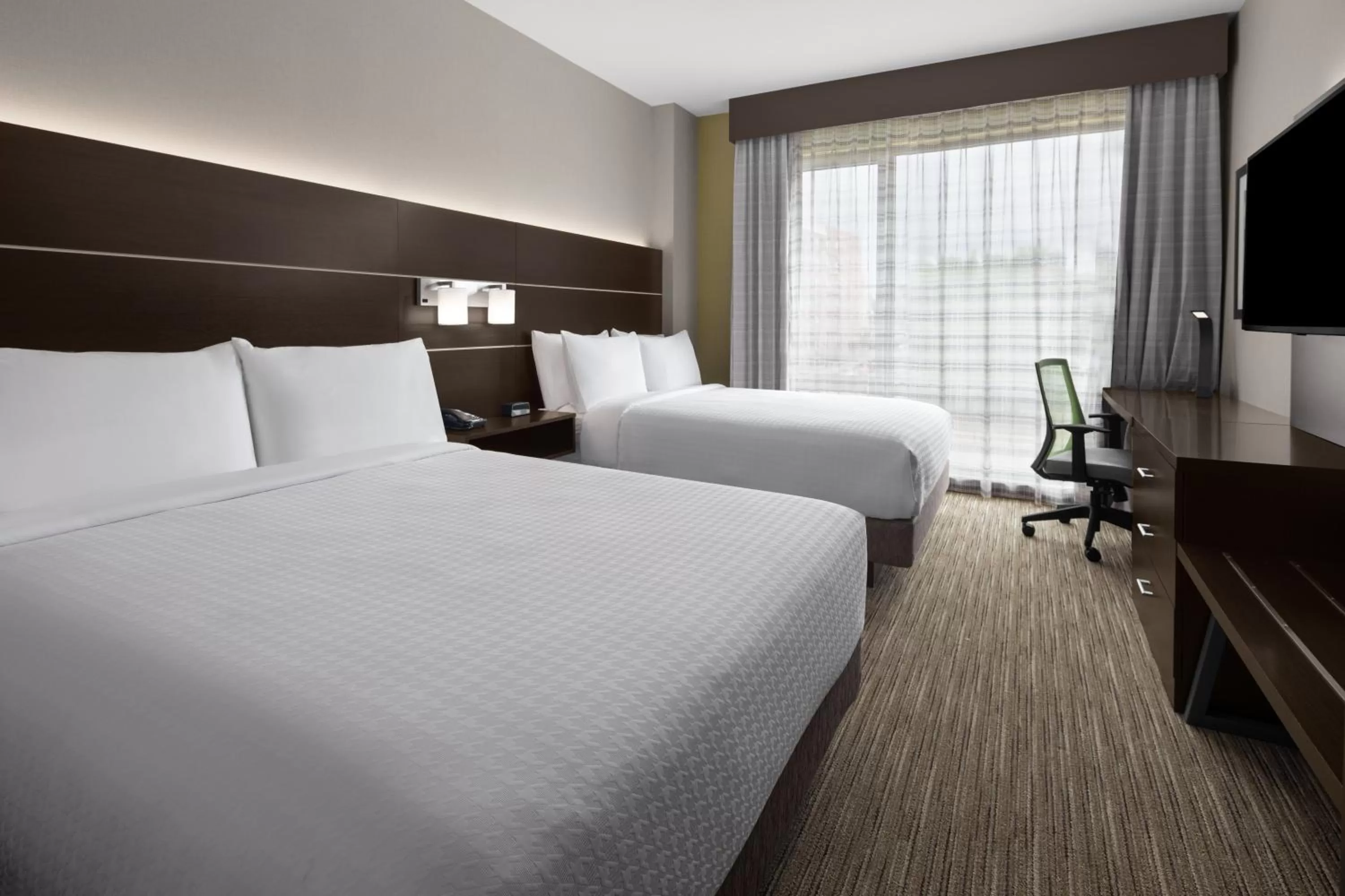Queen Room with Two Queen Beds and Mobility Accessible Roll-In Shower in Holiday Inn Express & Suites - Woodside Queens NYC, an IHG Hotel