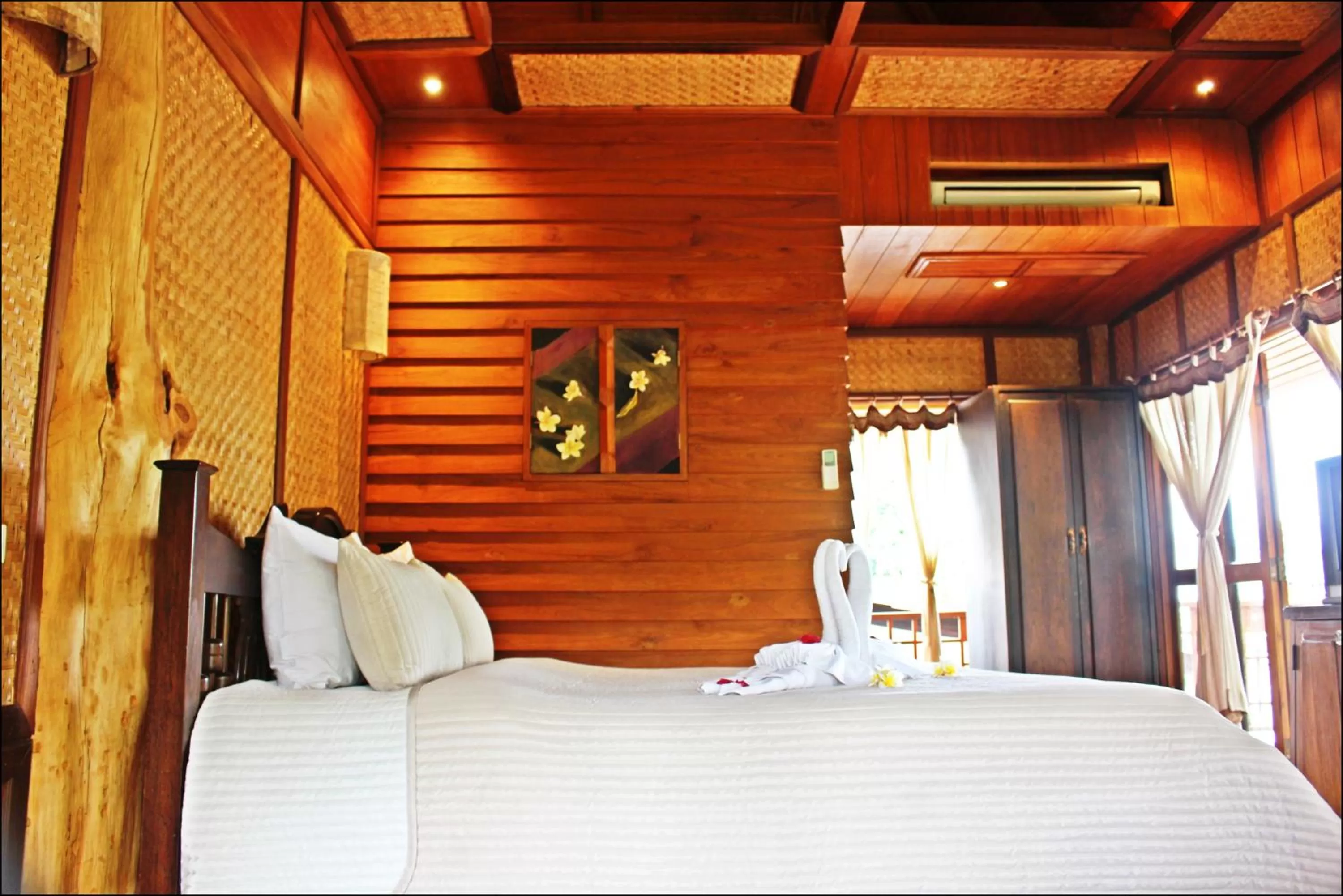 Bed in Pai Vimaan Resort