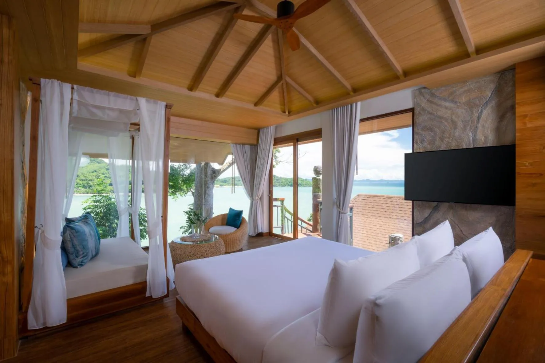 Bed in SINAE Phuket Luxury Hotel