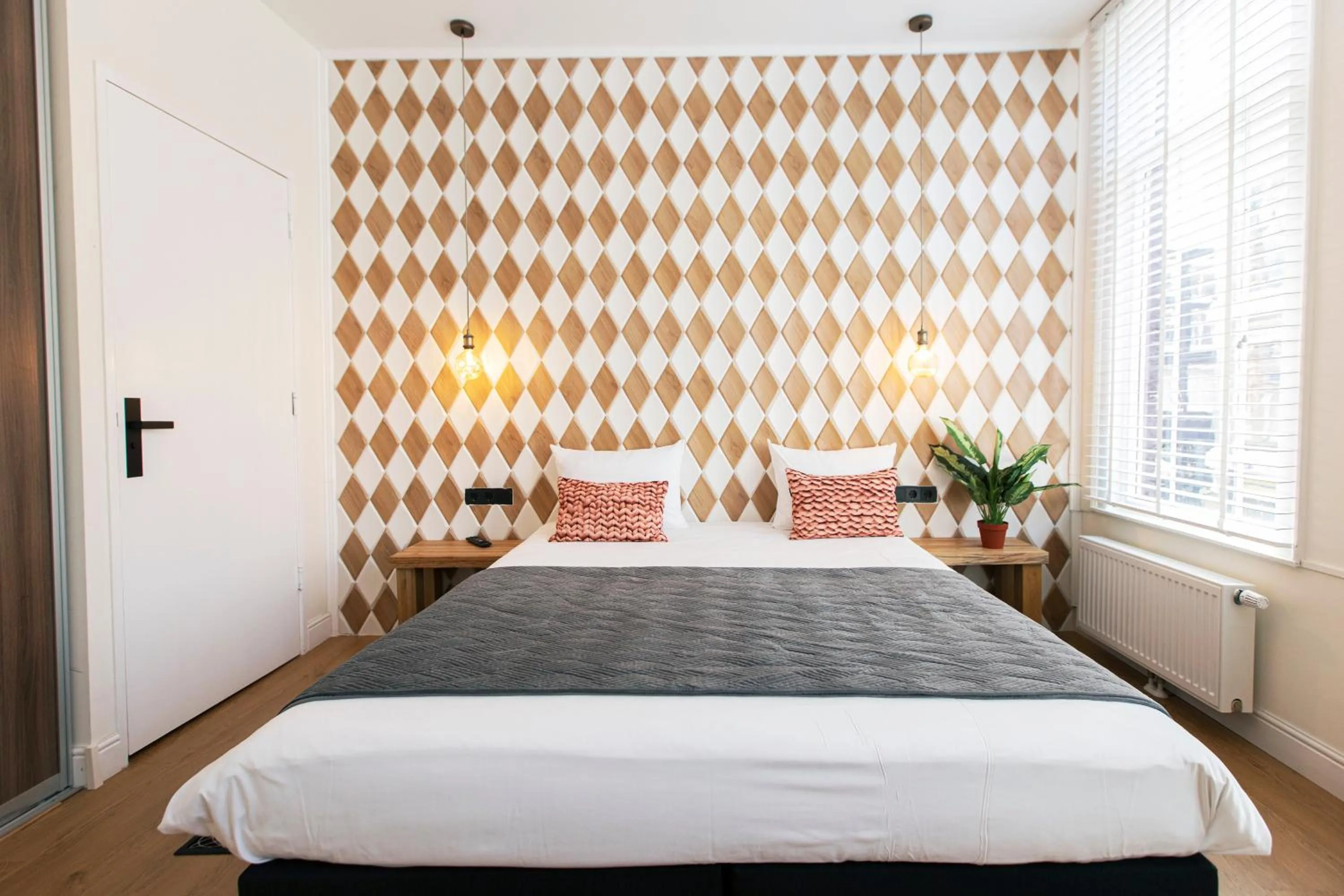 Bed in Quentin Golden Bear Hotel